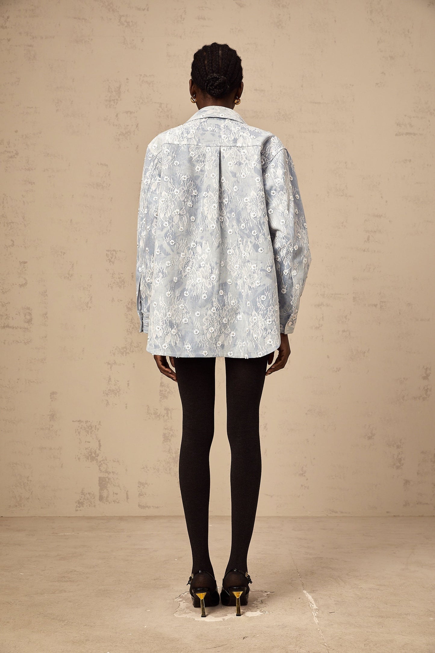 Denim jacket in light blue with blue sequin details and floral applique designs
