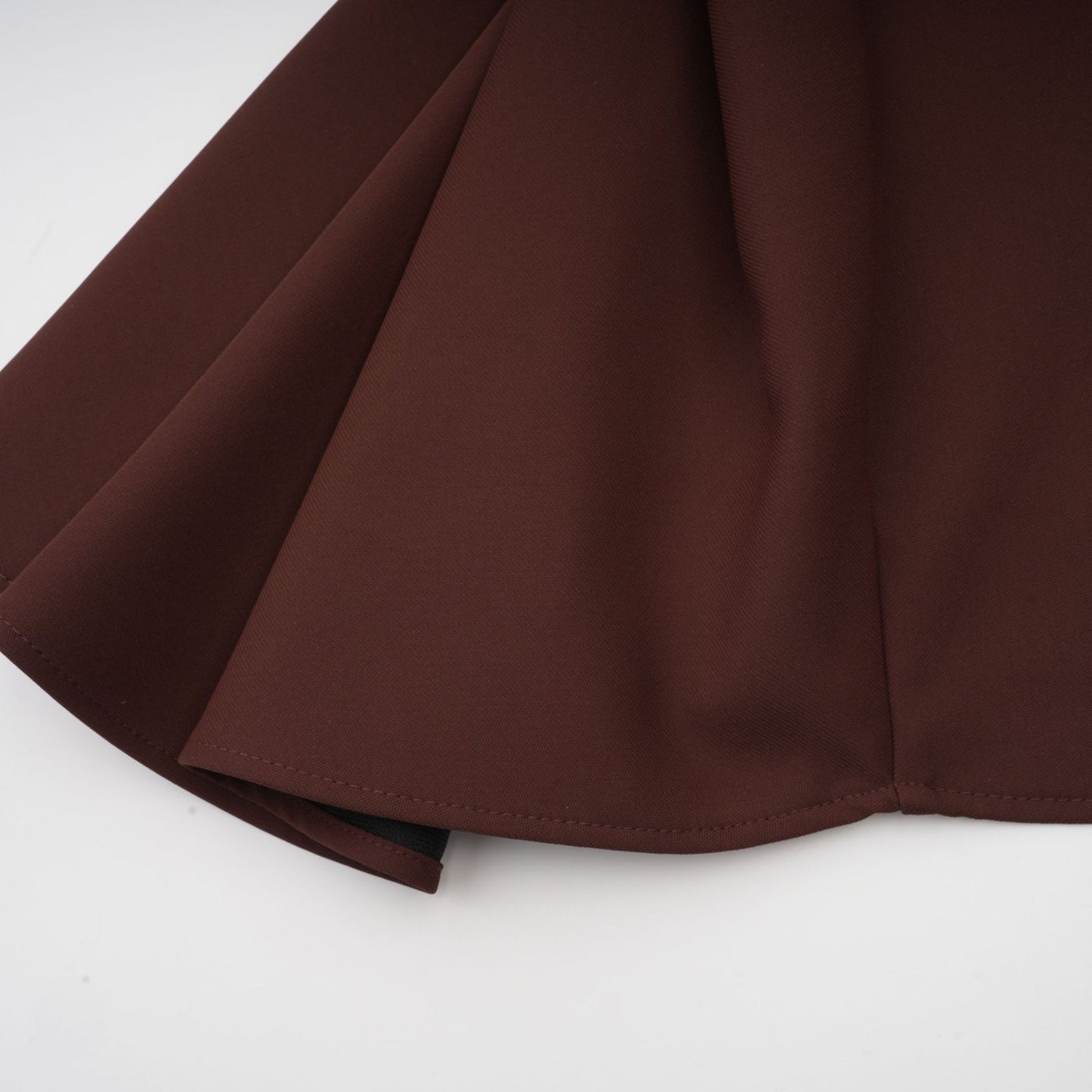 Dora brown mini dress with asymmetric neckline and puff sleeves