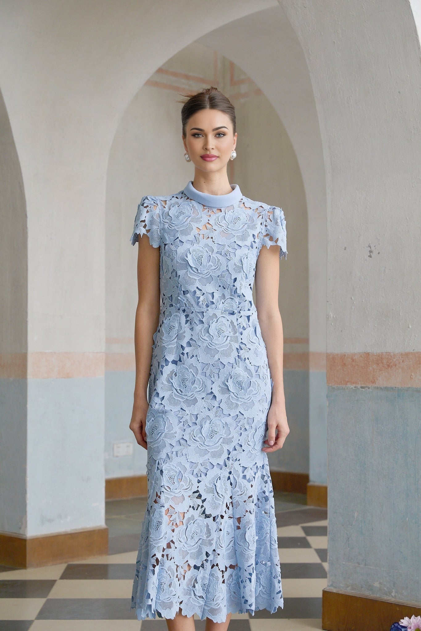Elegant blue midi dress with delicate floral lace applique details and feminine silhouette