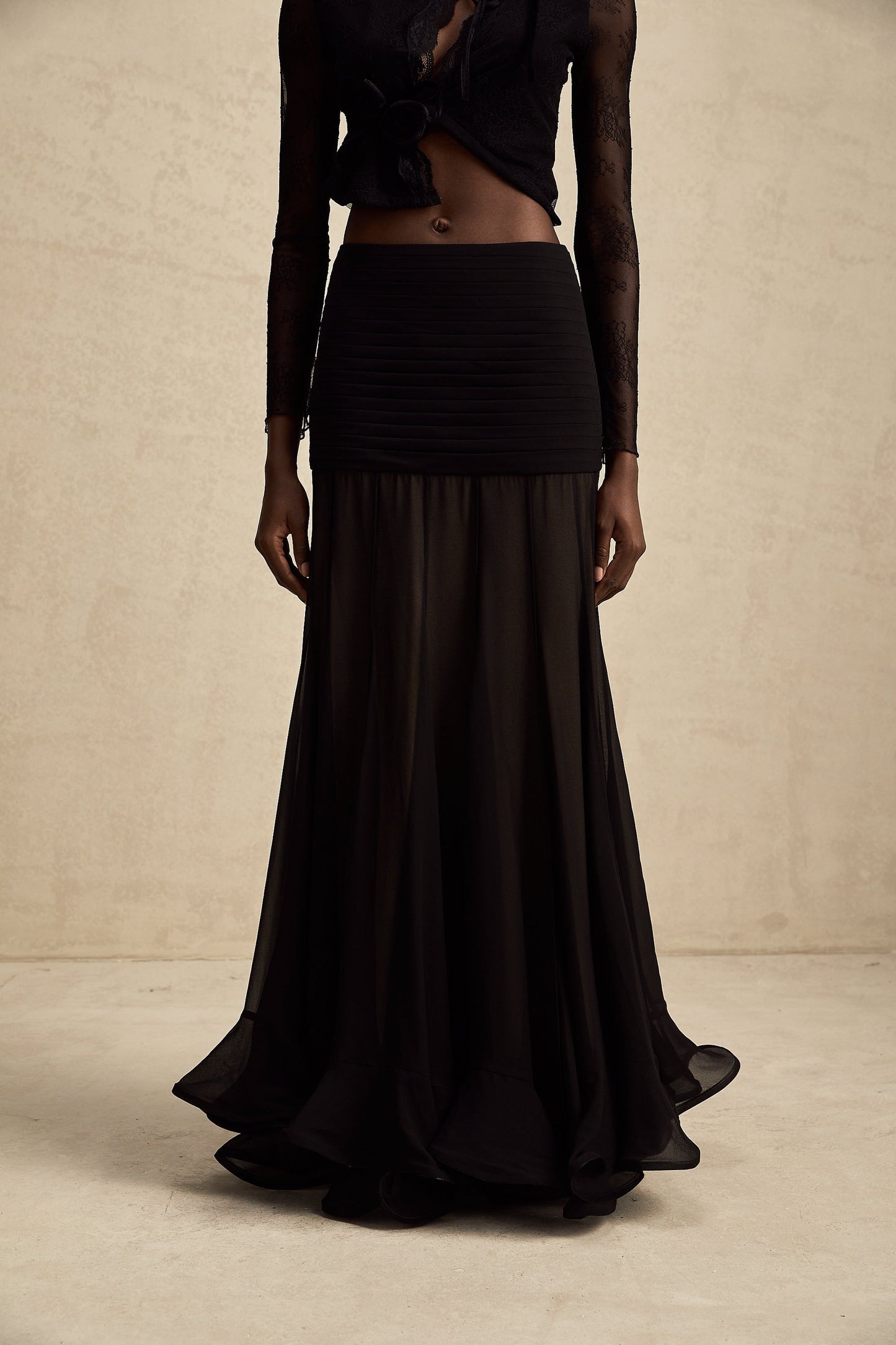 Elegant long maxi skirt with ruffles and pleats made of rayon and tulle fabric in a flowing design