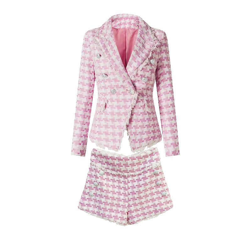 Pink houndstooth double-breasted blazer with silver buttons paired with matching high-waisted shorts