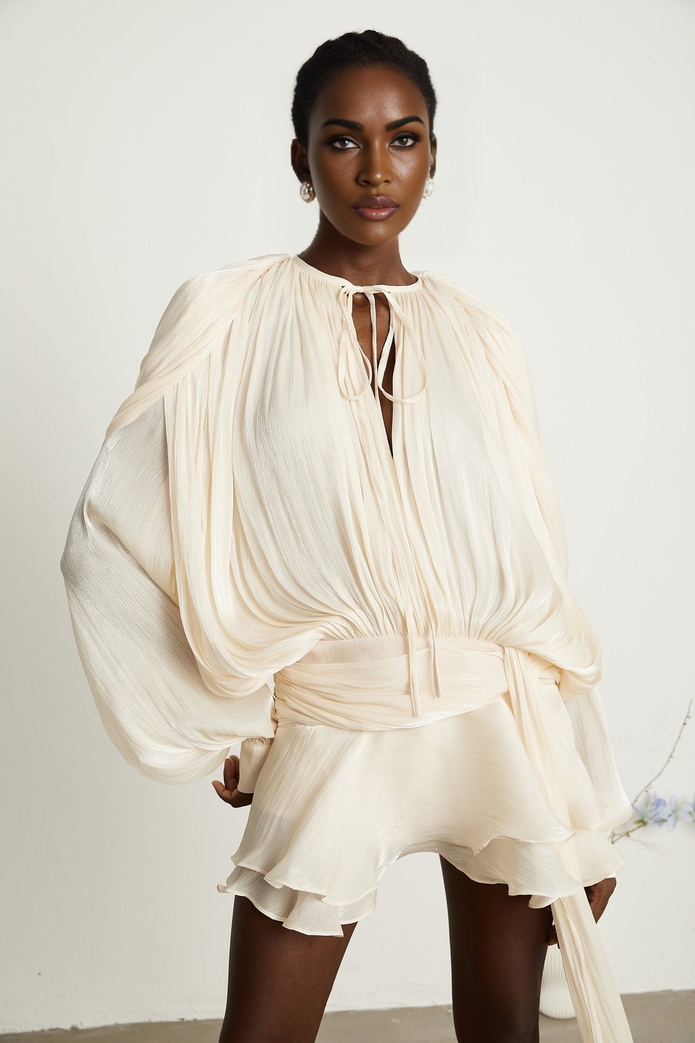 Eugenie fully pleated ruffled mini dress in neutral color tones