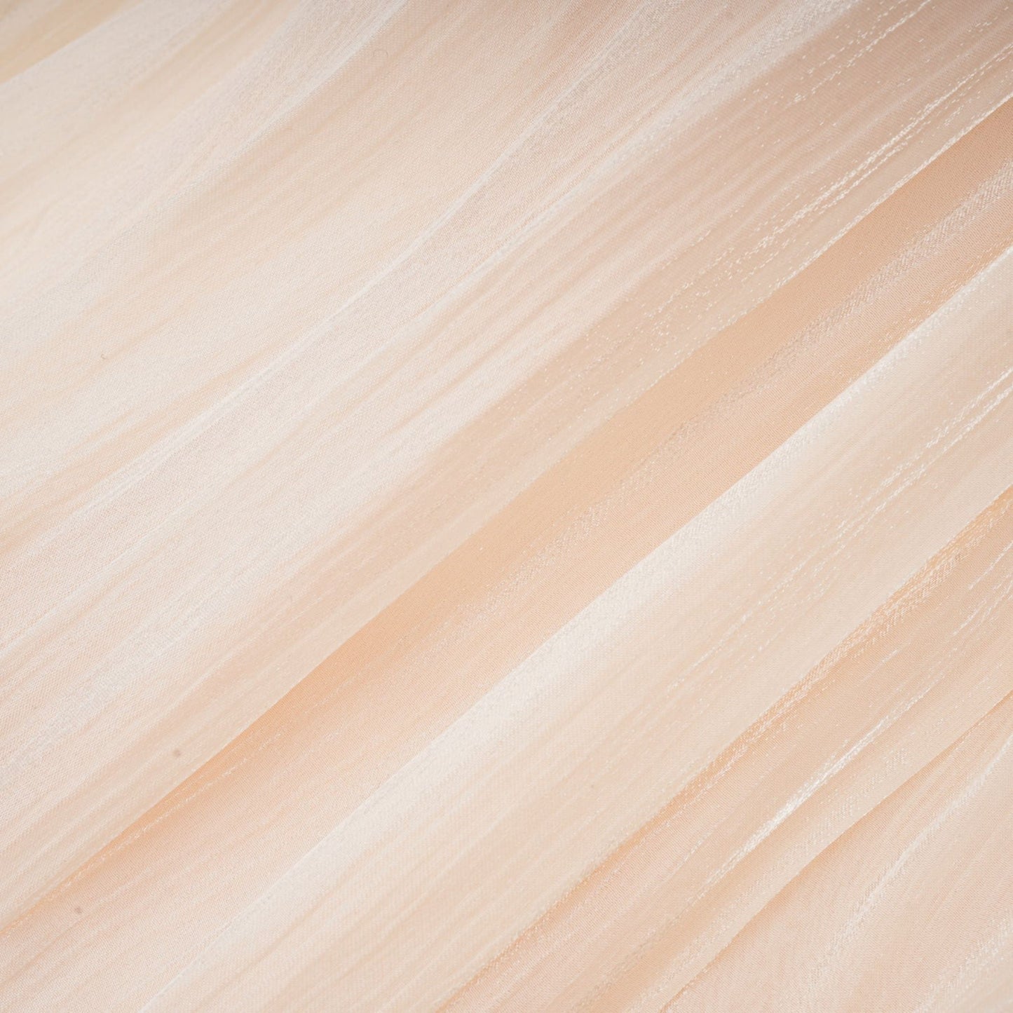Eugenie fully pleated ruffled mini dress in neutral tones displayed on a mannequin