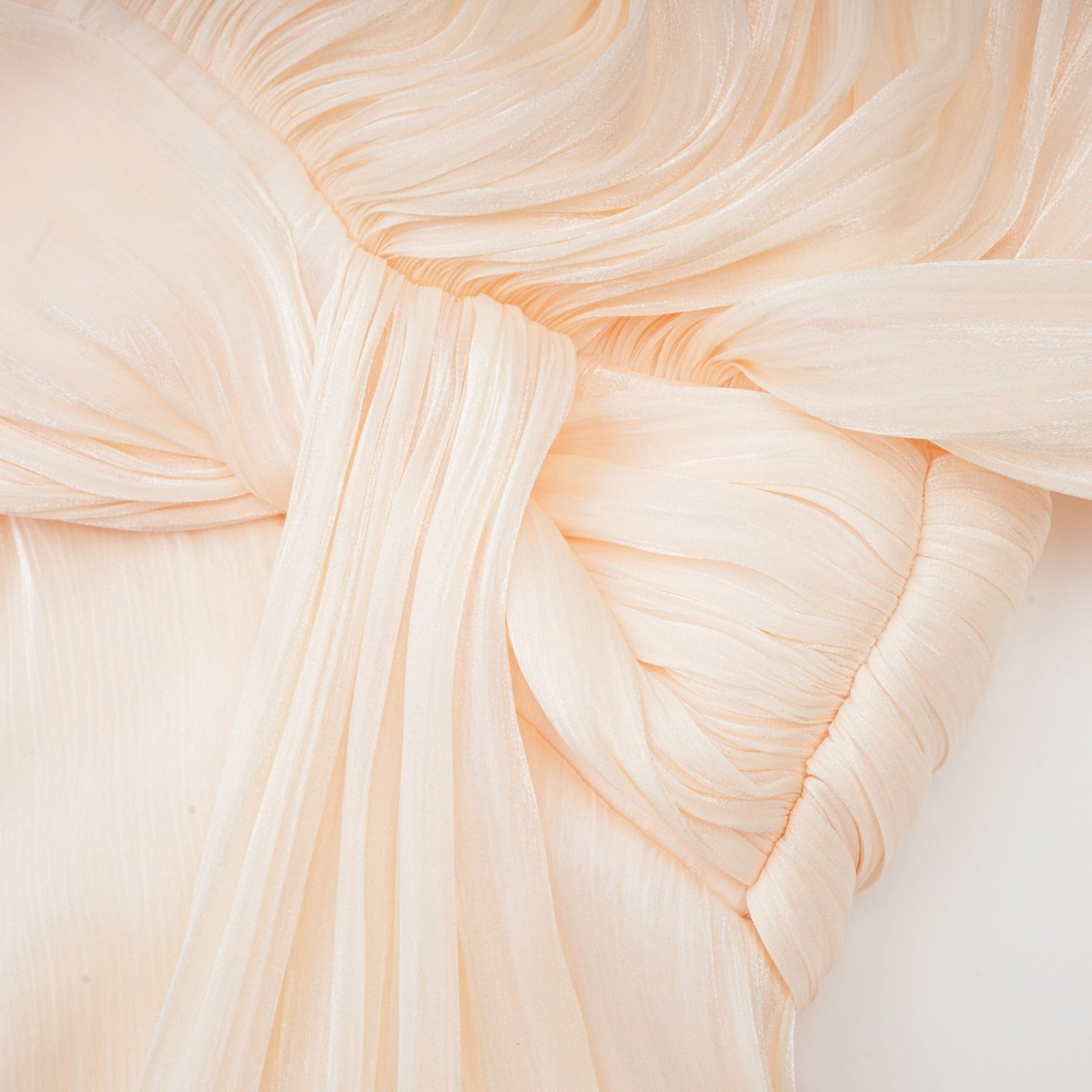 Eugenie pleated ruffled mini dress in neutral color with full skirt and delicate feminine details