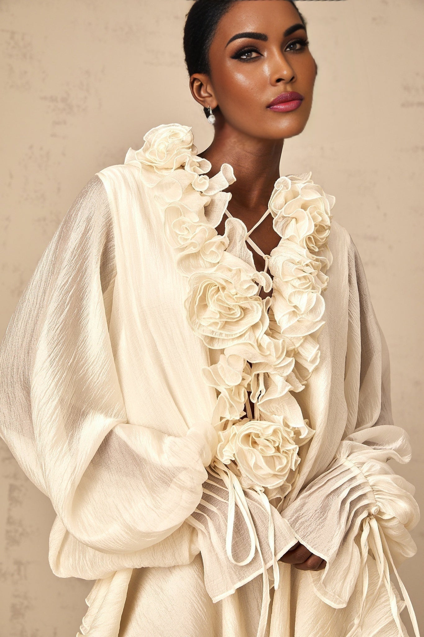 Floral applique tiered mini dress in neutral tones with delicate Zephyrine design