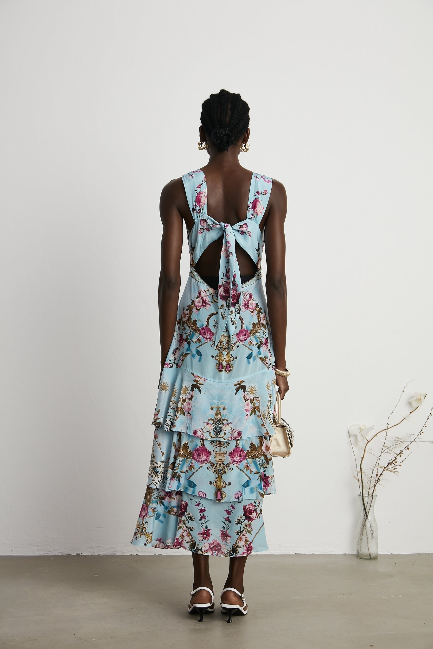Floral print midi dress in Victoire style with vibrant colors and flowing fabric