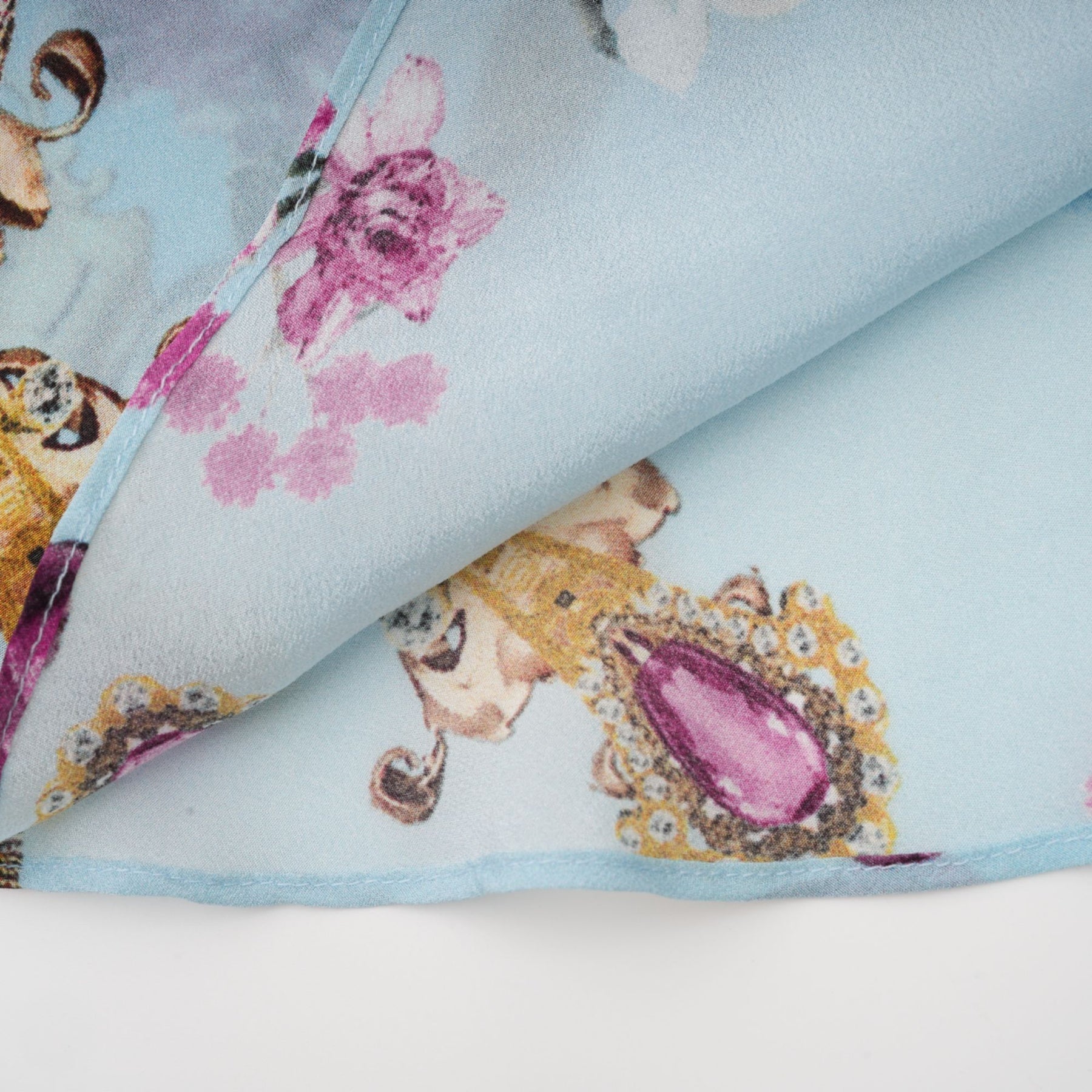 Floral print midi dress named Victoire featuring a colorful flower pattern on a light background with long sleeves and a flowing skirt