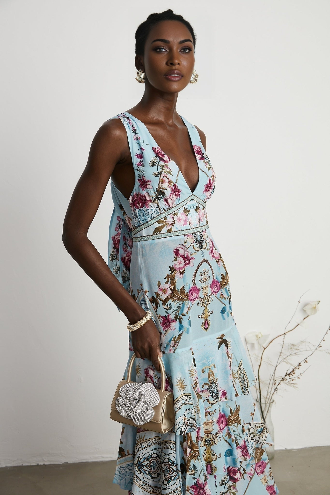 Floral print midi dress named Victoire with a colorful pattern on a light background