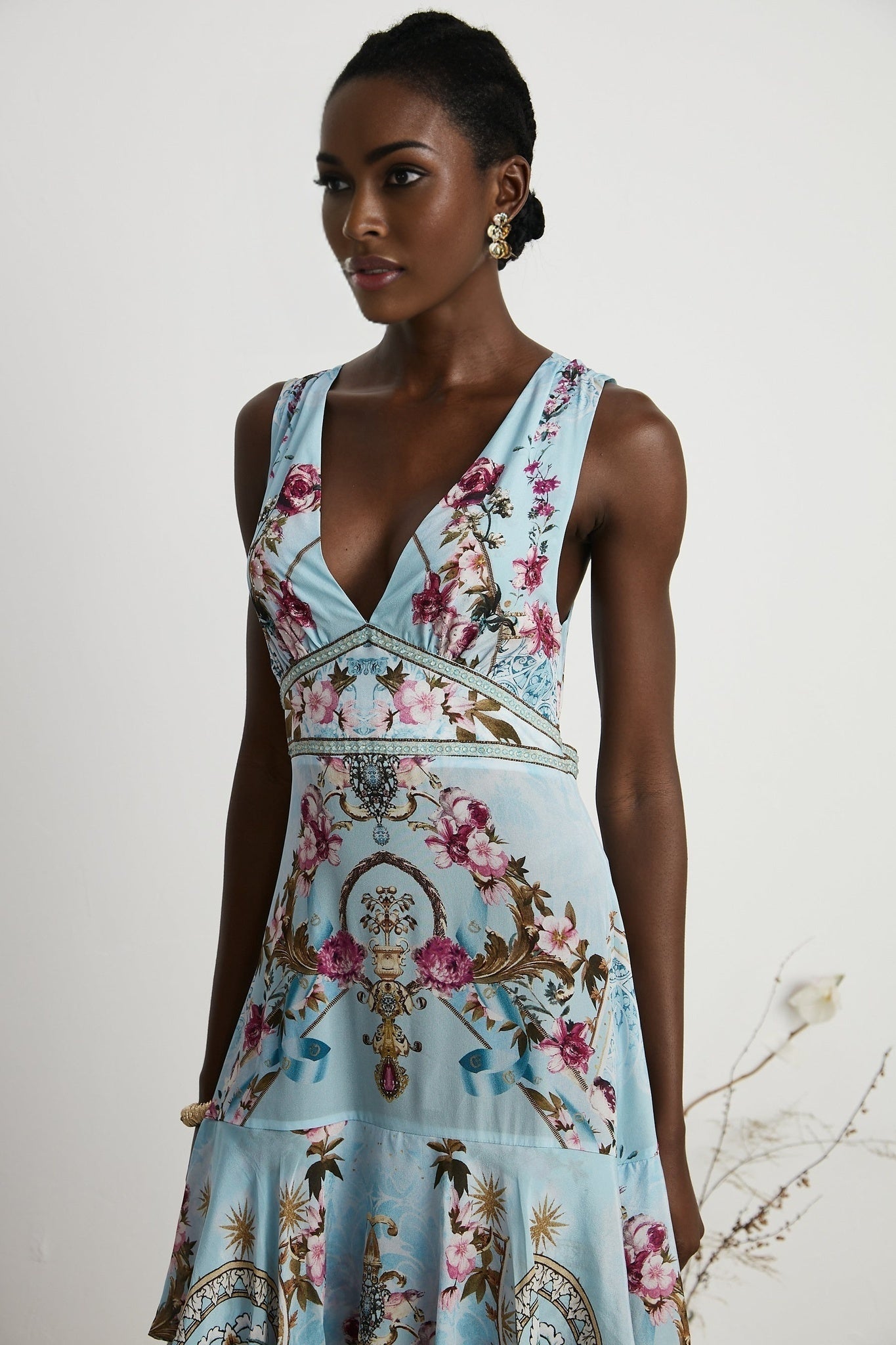 Floral print midi dress named Victoire with a vibrant pattern on a light background
