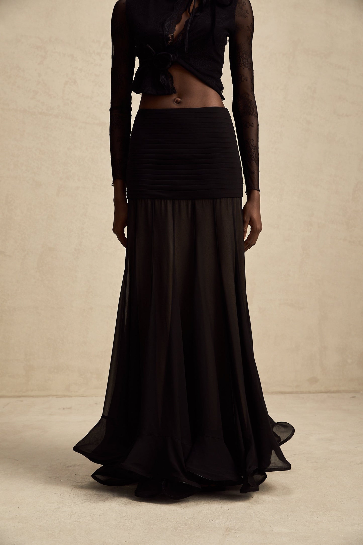 Flowy maxi skirt with ruffles and pleats made from rayon and tulle fabric in a light color