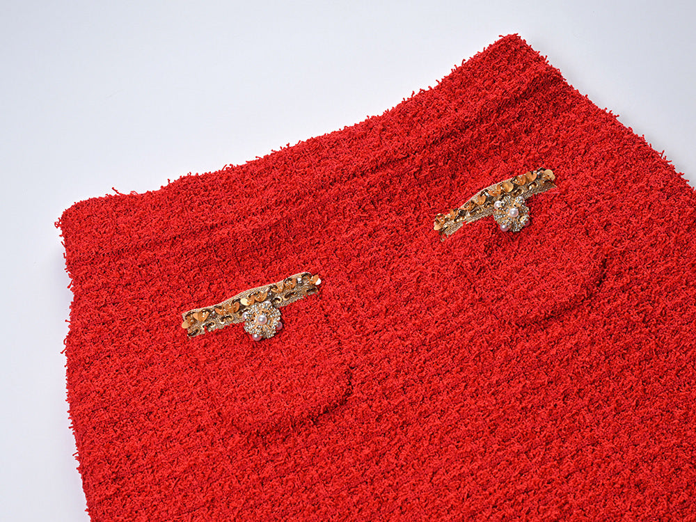 Elegant red tweed jacket with gold embellishments paired with a matching midi skirt, ideal for formal occasions