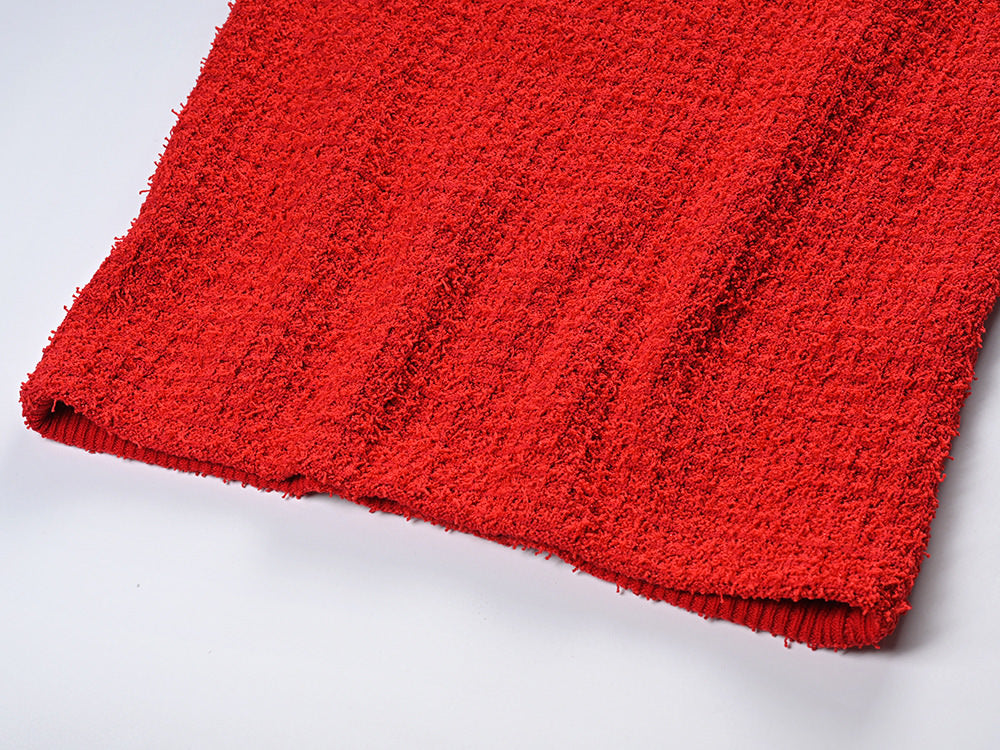 Elegant red tweed jacket with gold embellishments paired with a matching midi skirt, ideal for formal occasions