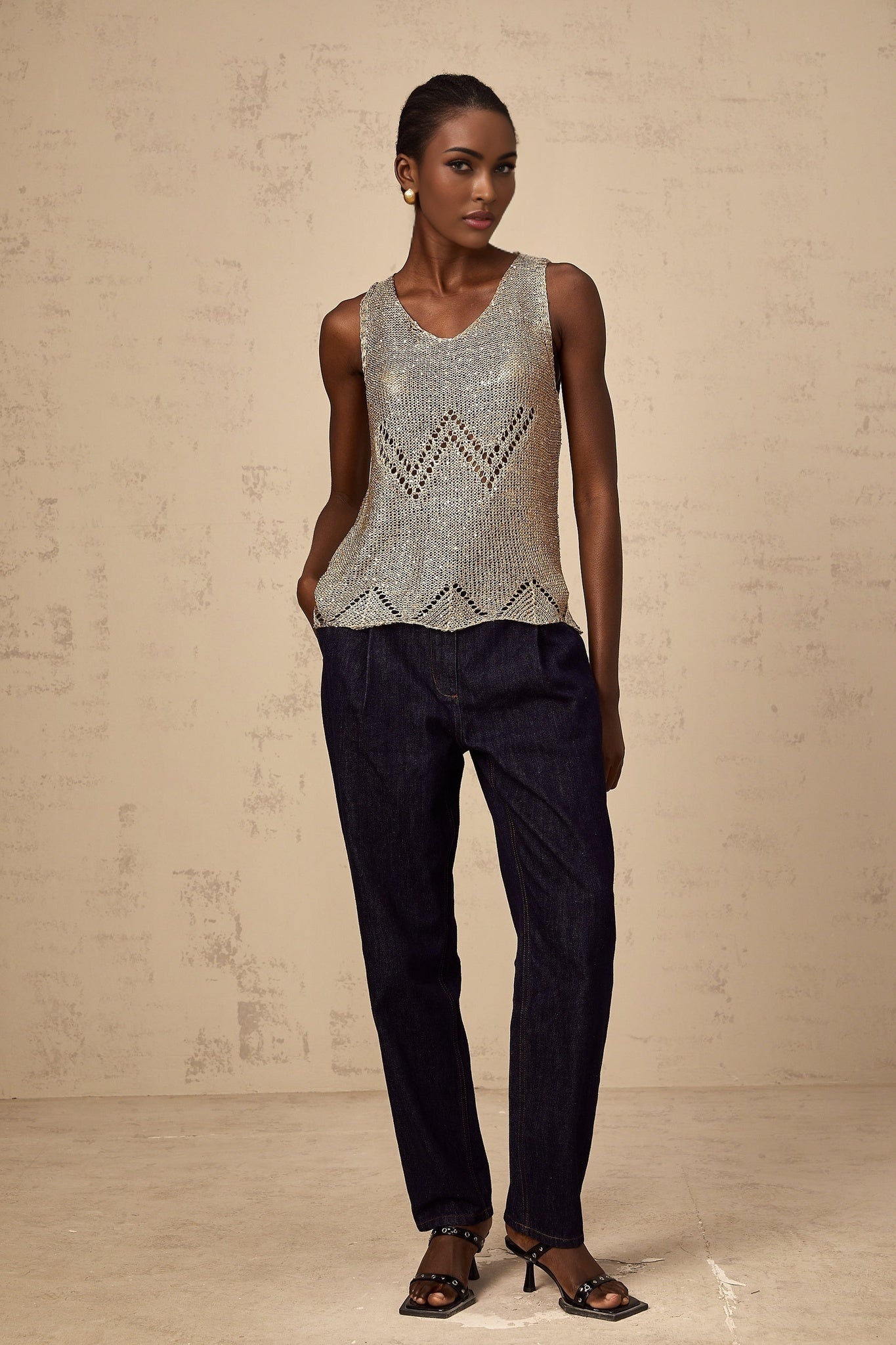 Gold sequined crochet vest top with sleeveless design and shimmering texture