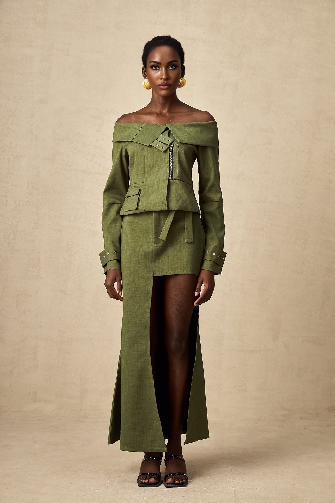 Green asymmetric jacket and skirt set named Elena featuring matching design
