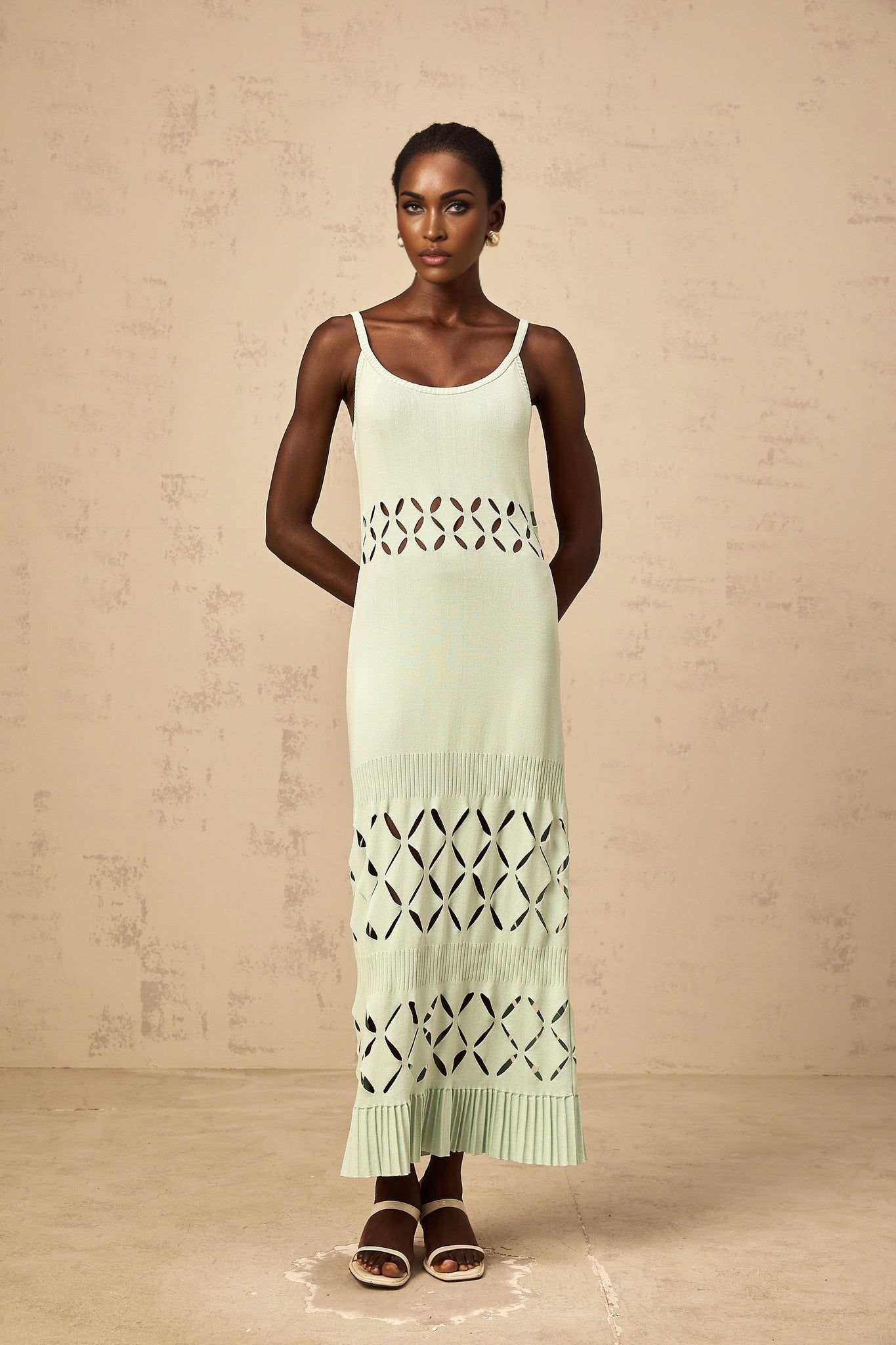 Green knitted maxi dress with cutout details featuring a long length and Leonore design