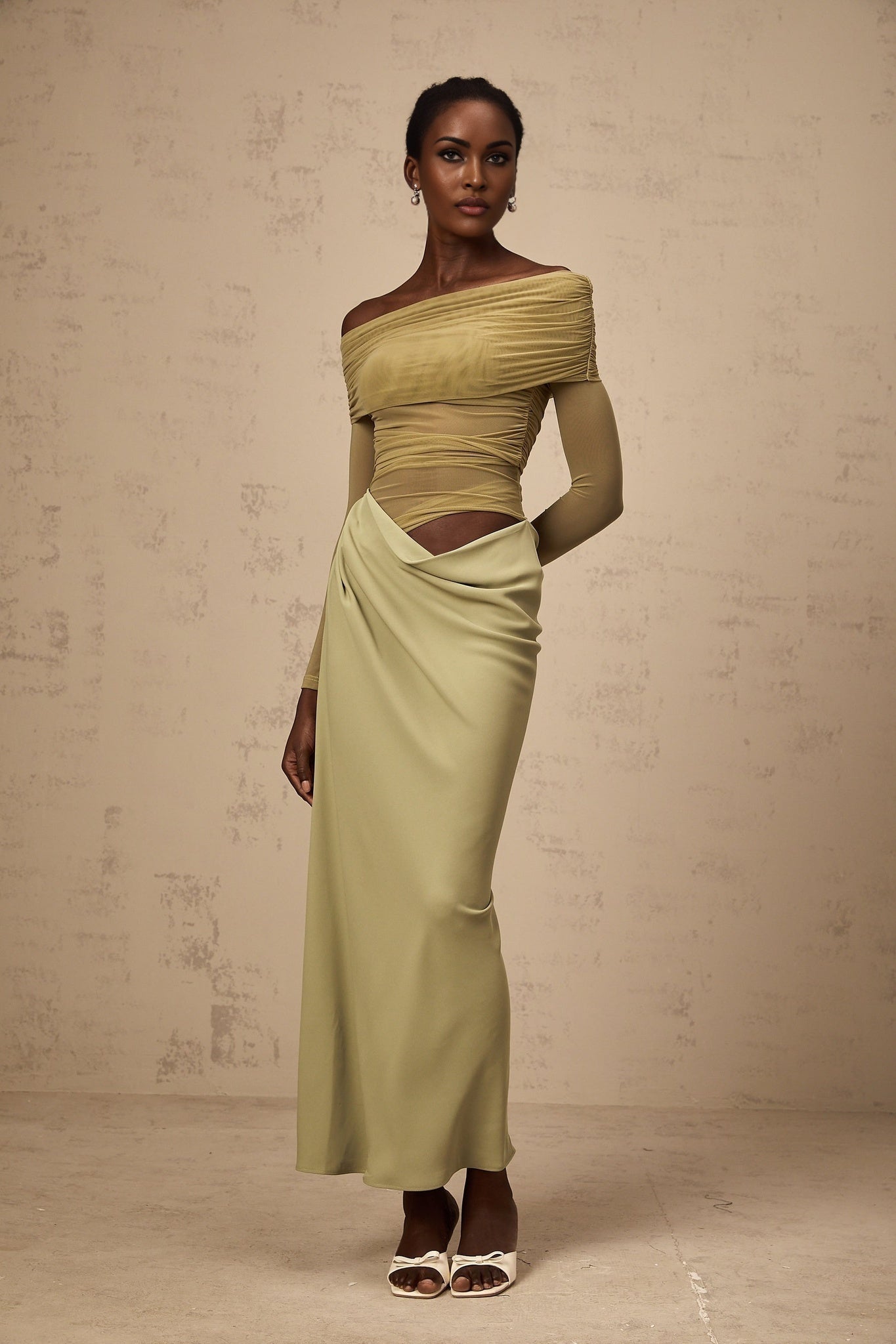 Green off shoulder midi dress with semi sheer fabric and flowy silhouette