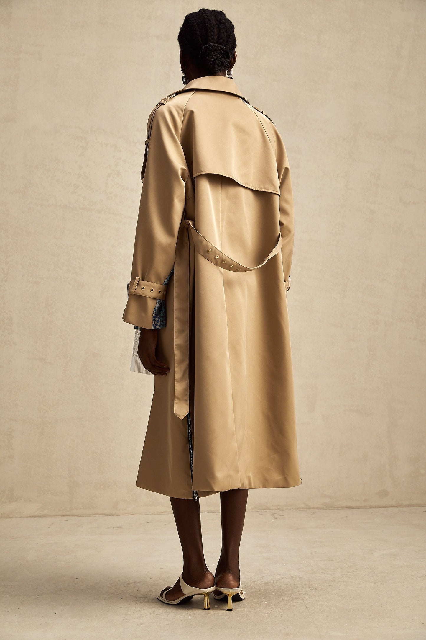 Heres a simple alt text for the product image based on the title
Woman wearing long beige trench coat with contrasting dark trim and belt tied at waist featuring allover print pattern