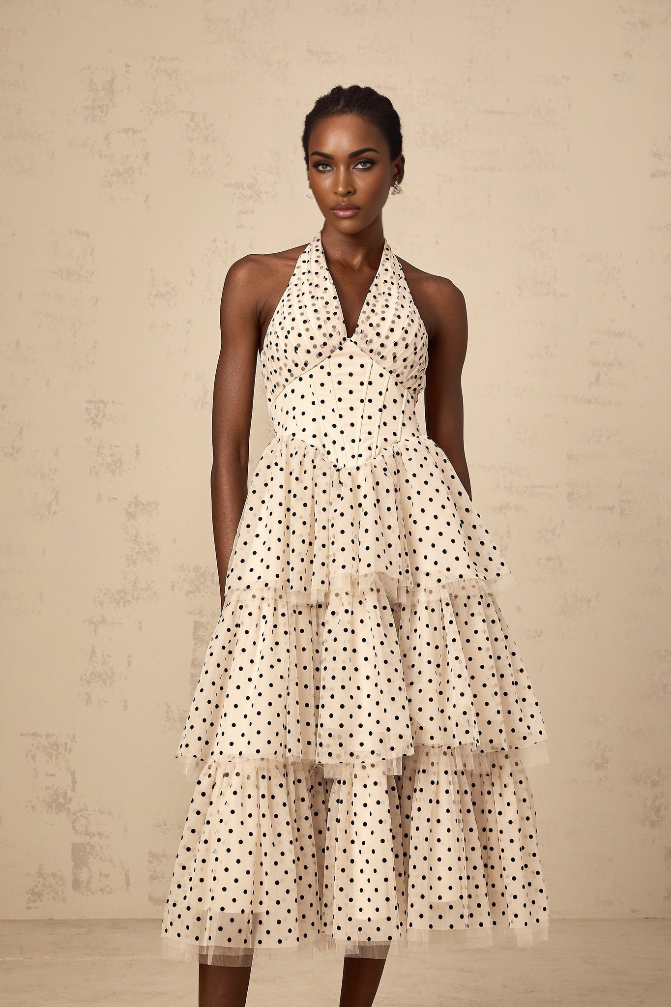 Ivory midi dress with polka dots and tiered skirt design