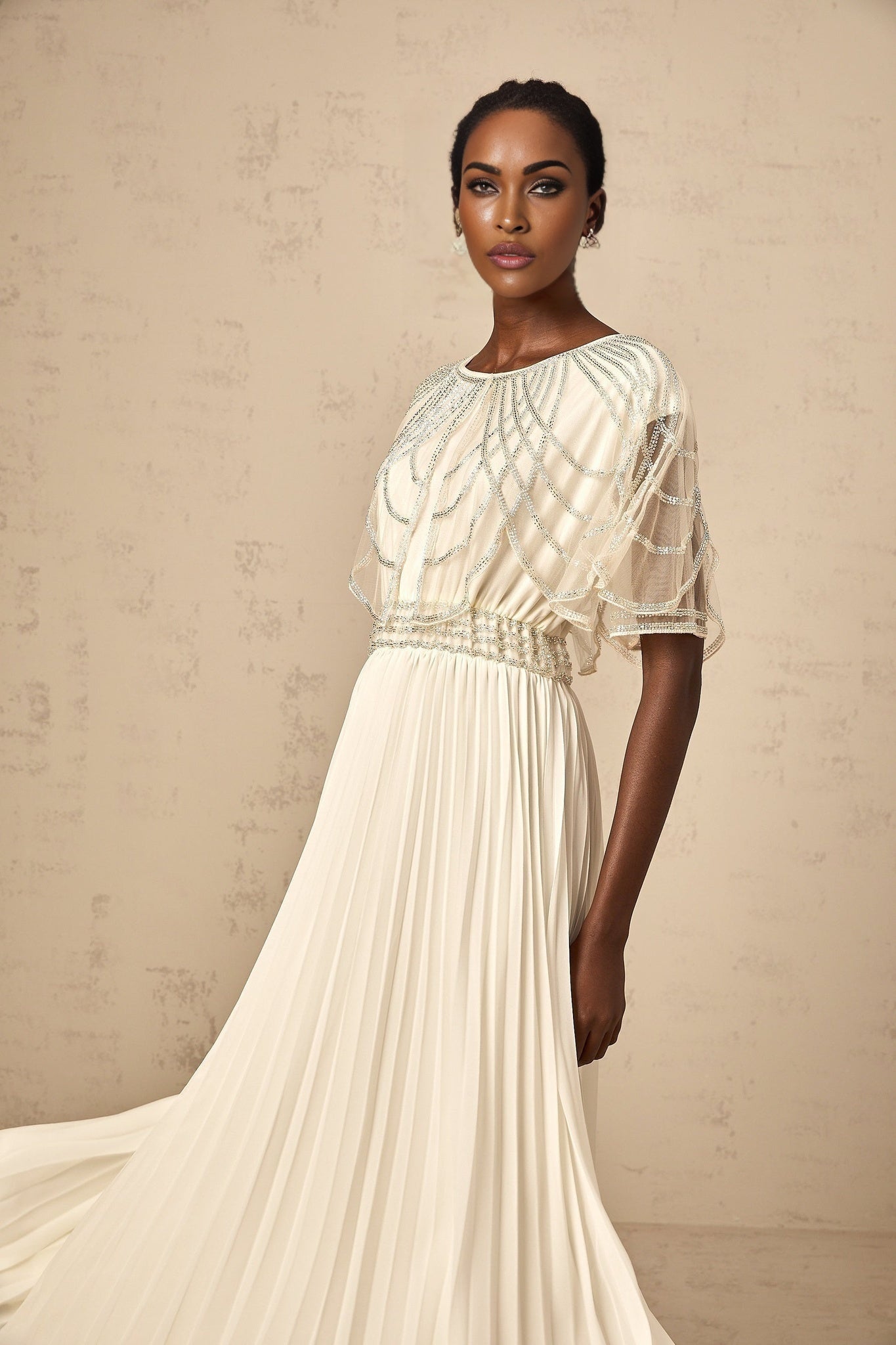 Long white pleated maxi dress with crystal embellishments named Xenia