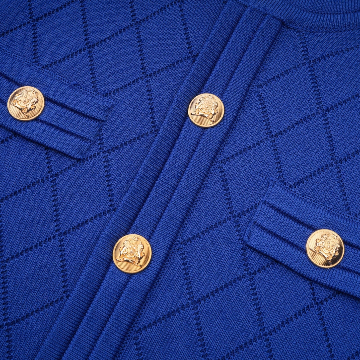 Maelys blue knitted matching set with button details on top and skirt