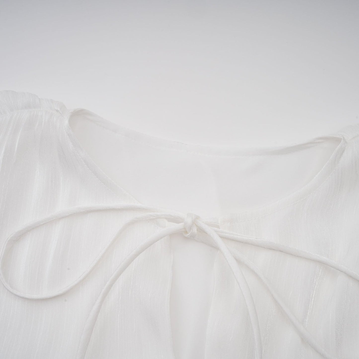 Mahault white pleated glittereffect mini dress