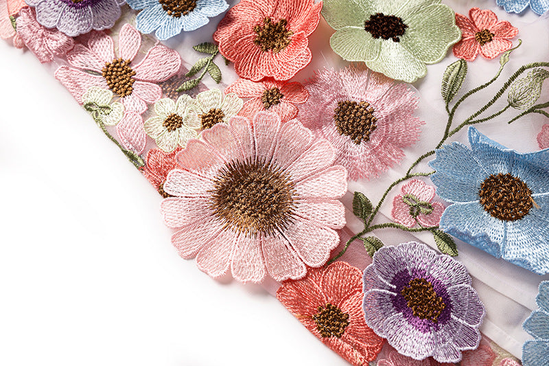 Multicolored floral embroidered A-line skirt with high-waist in soft pastel palette and vibrant accents