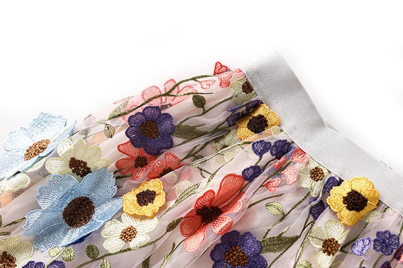 Multicolored floral embroidered A-line skirt in soft pastel palette with vibrant accents