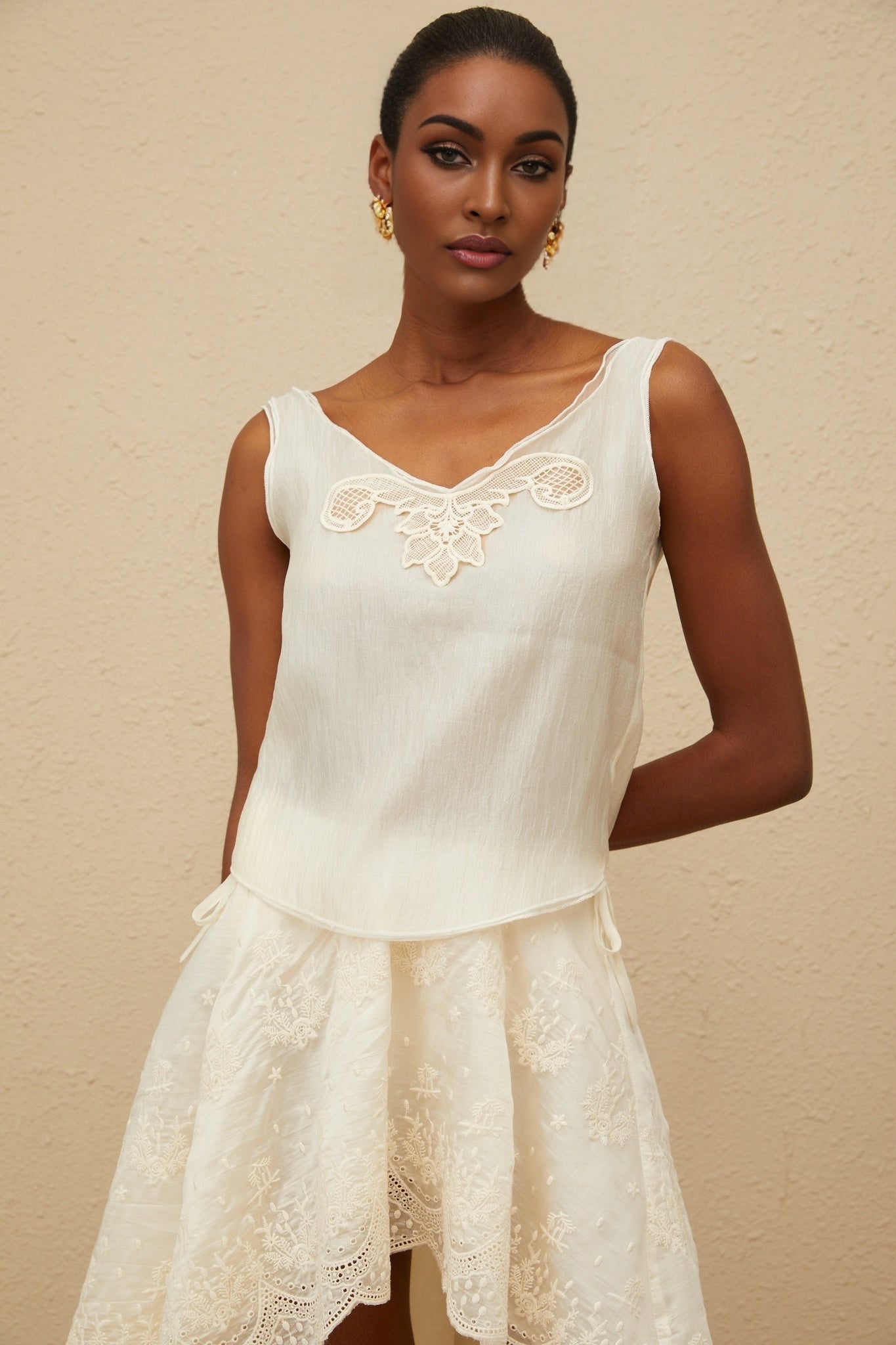 Neutrals lace trim sleeveless top and high rise asymmetrical skirt set in Tencel and Terylene composition