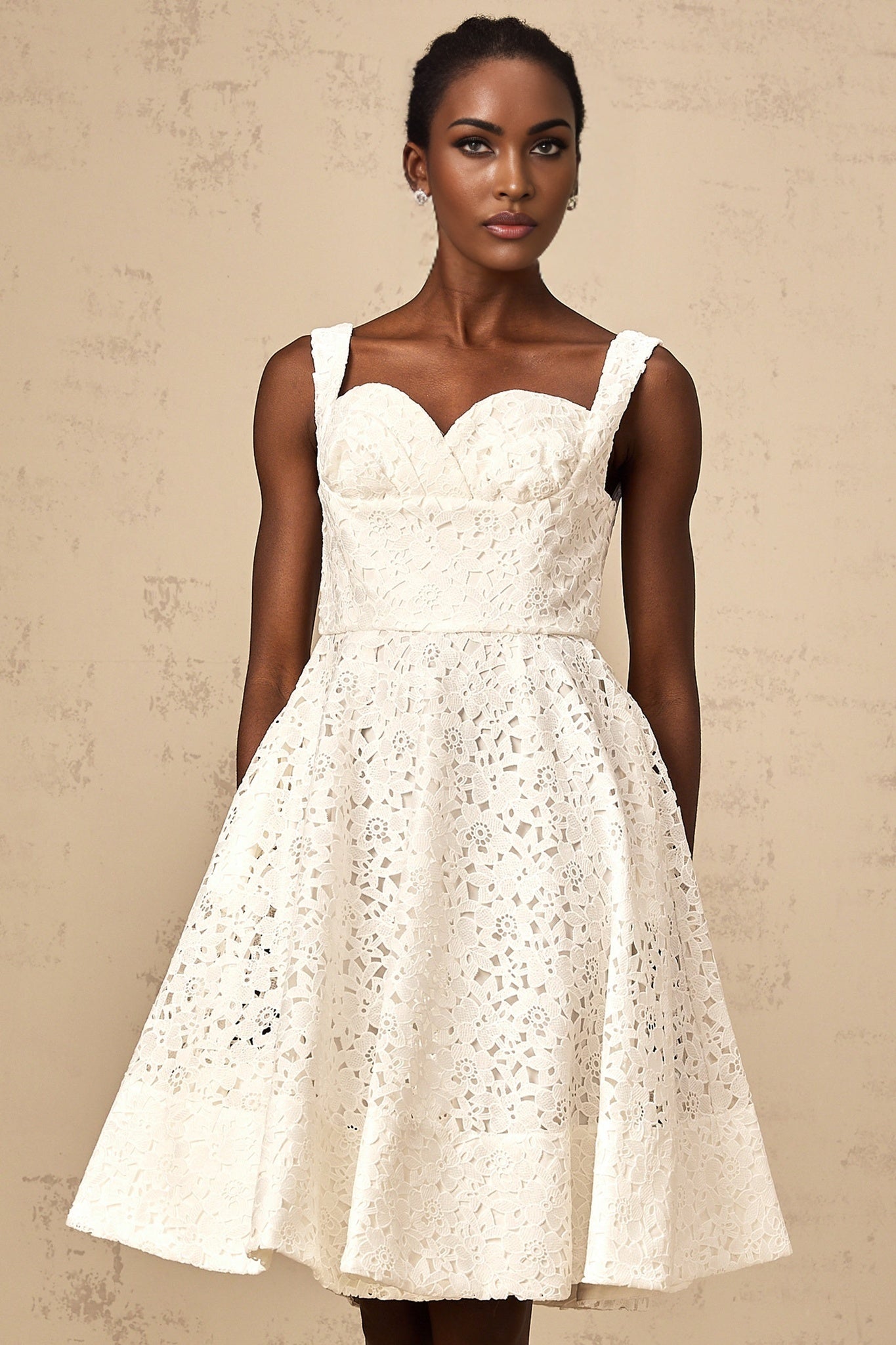 Nicolette white midi dress with floral lace pattern and feminine silhouette
