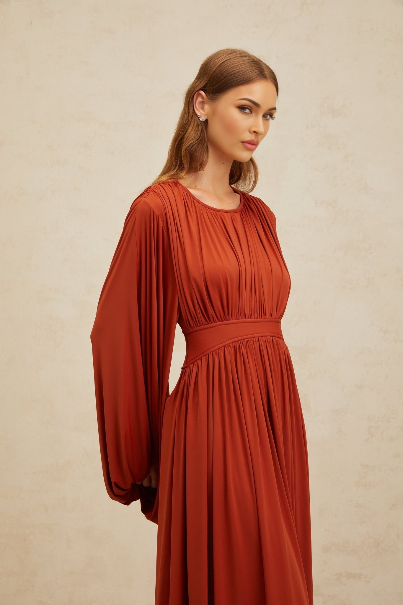 Orange long puff sleeve maxi dress with cinched waist and pleated detailing