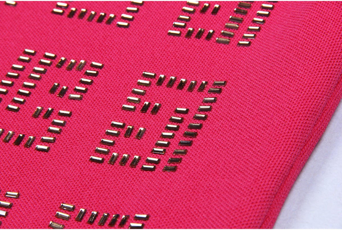 Bold pink geometric patterned cutout dress with metallic accents