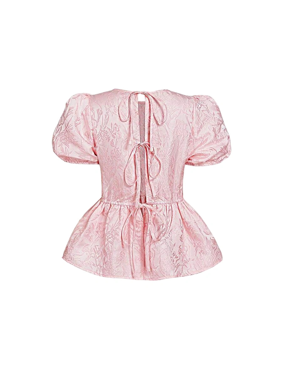 Pink jacquard blouse with puff sleeves and open back with ties