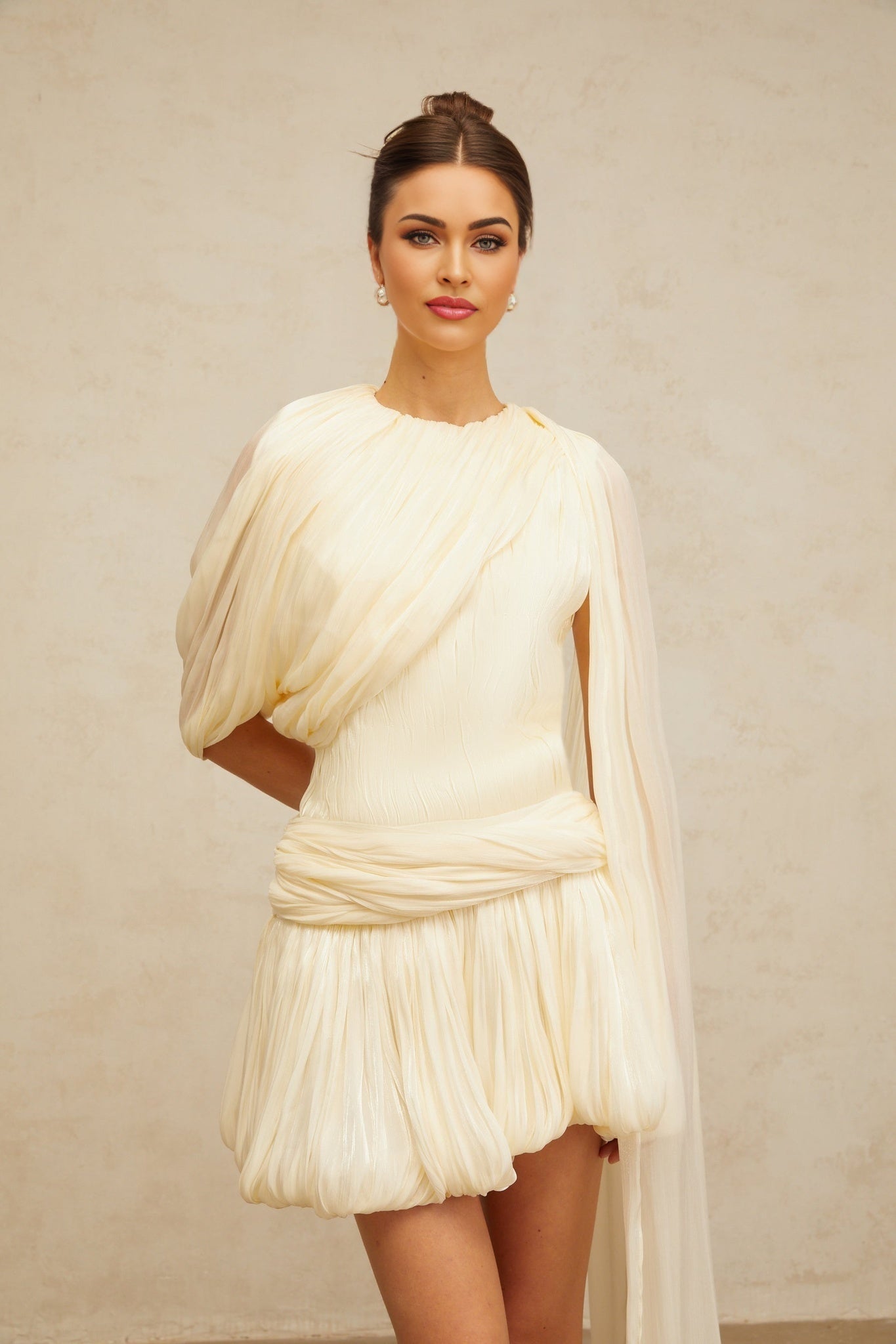 Pleated mini dress with ribbon design accent featuring short sleeves and a flowy silhouette in light fabric