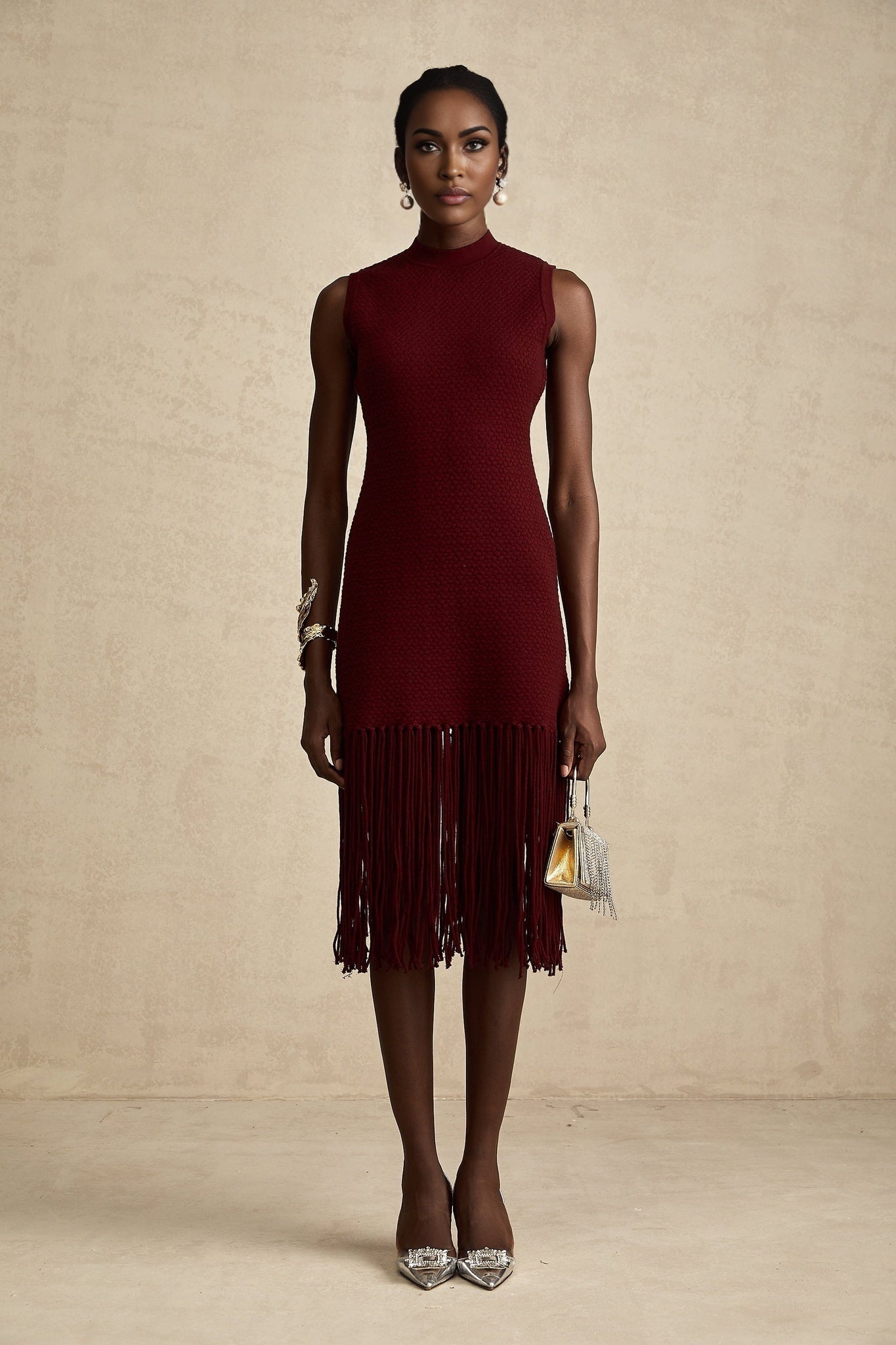 Red knitted midi dress by Celine with fringe details