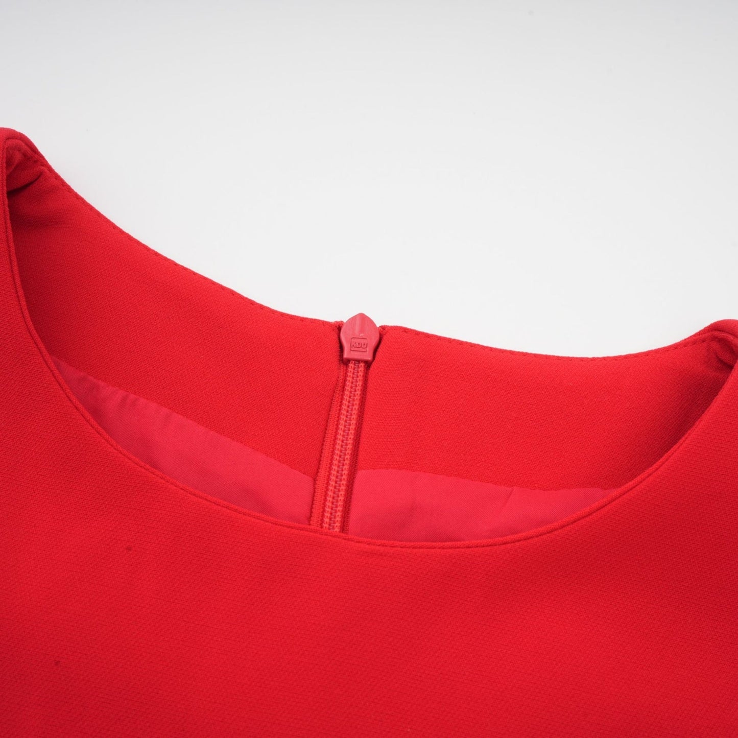 Red long sleeve dress with floral embellishments by Aurelia