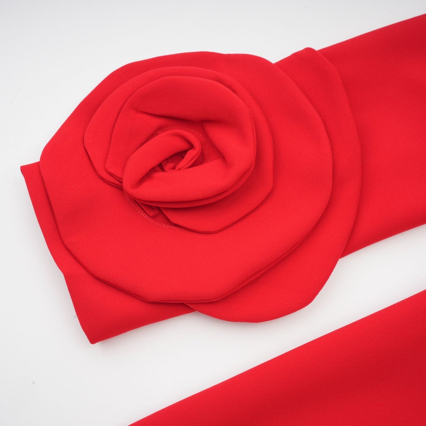 Red long sleeve dress with floral embellishments by Aurelia