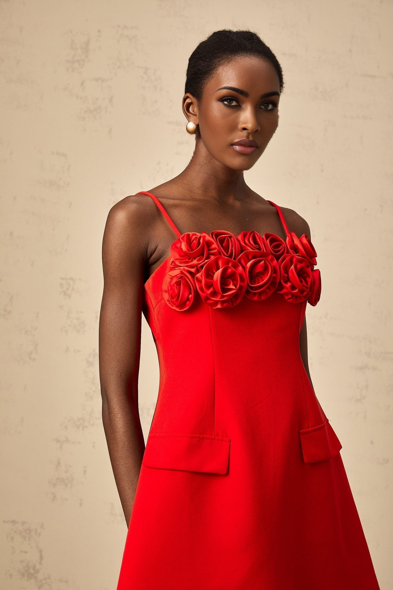Red mini dress with flared skirt and rose applique details