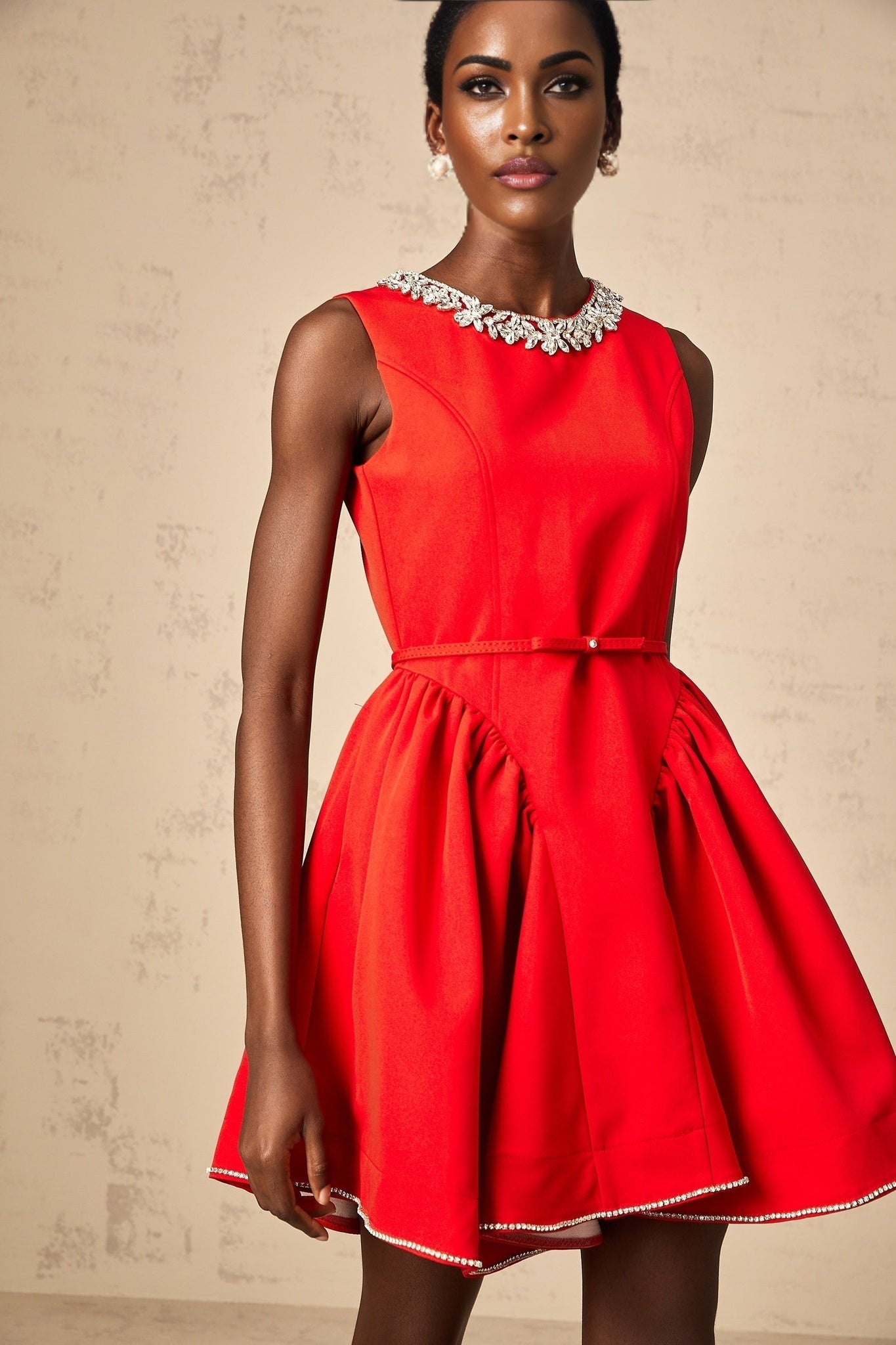 Red pleated mini dress with embellishments named Leonie
