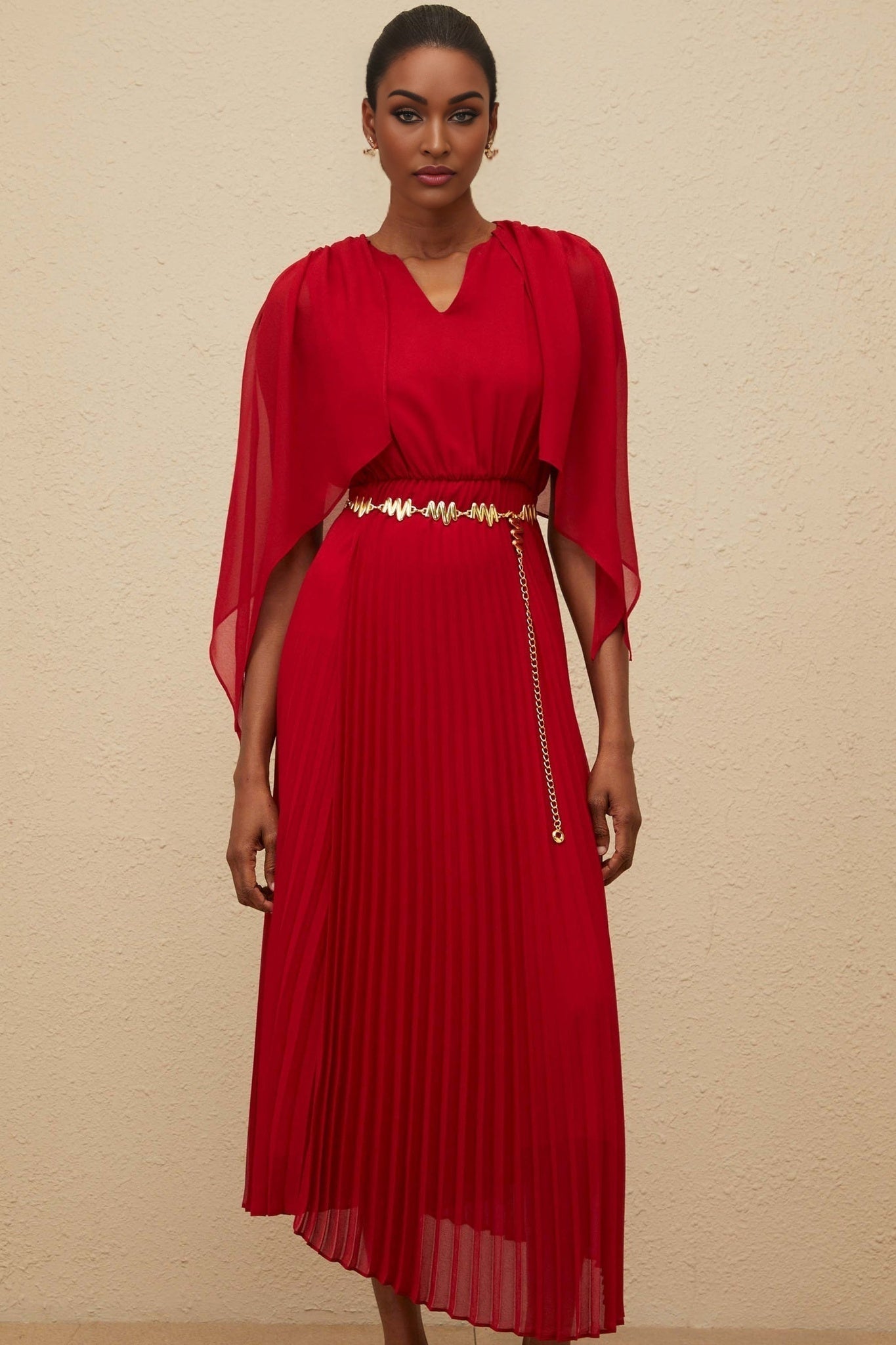 Red V-neck sleeveless maxi dress with cape design and chain-link detailing