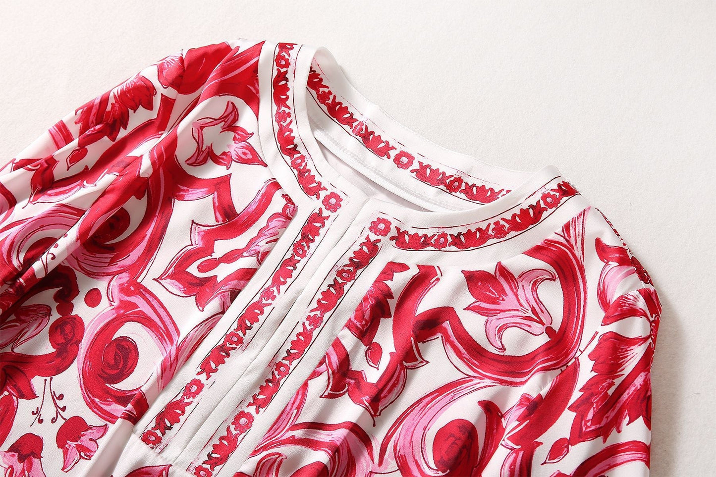 Red and white boho-chic maxi dress with baroque-inspired print and bell sleeves
