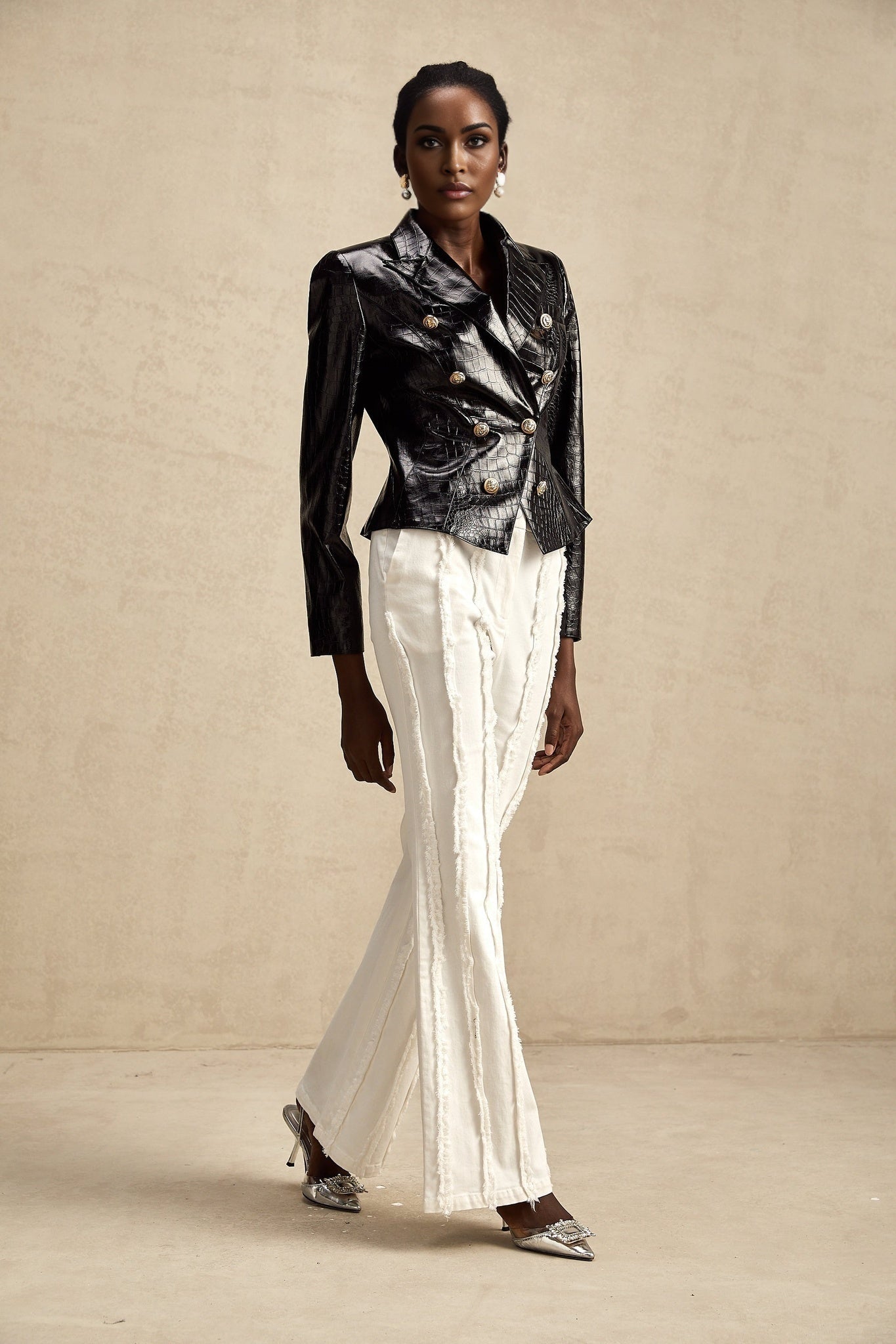 Sleek black leather jacket with cinched waist detail by Elodie