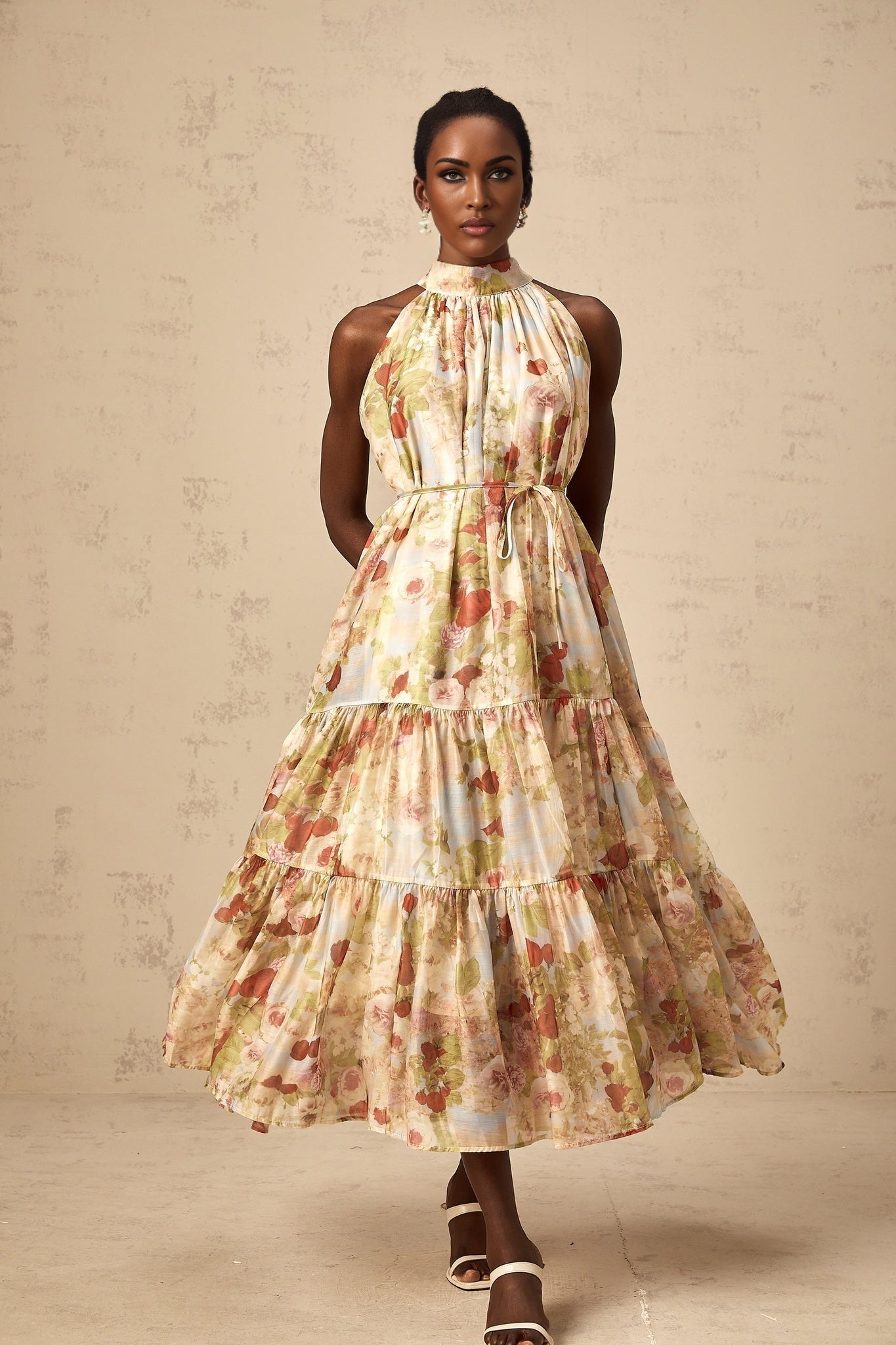 Sleeveless floral midi dress in neutral tones with allover print