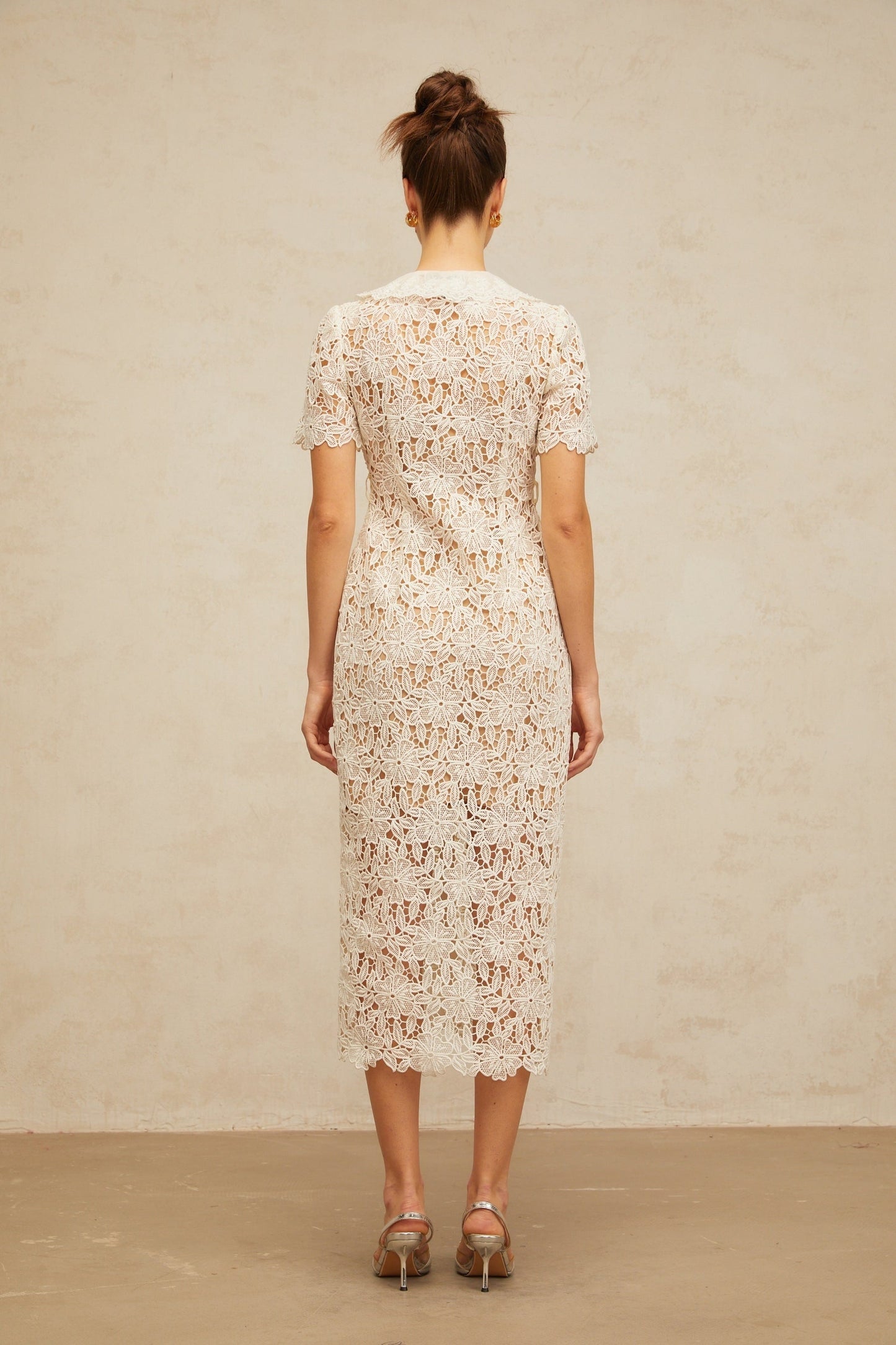 Sophie off white corded lace midi dress on a mannequin against a plain background