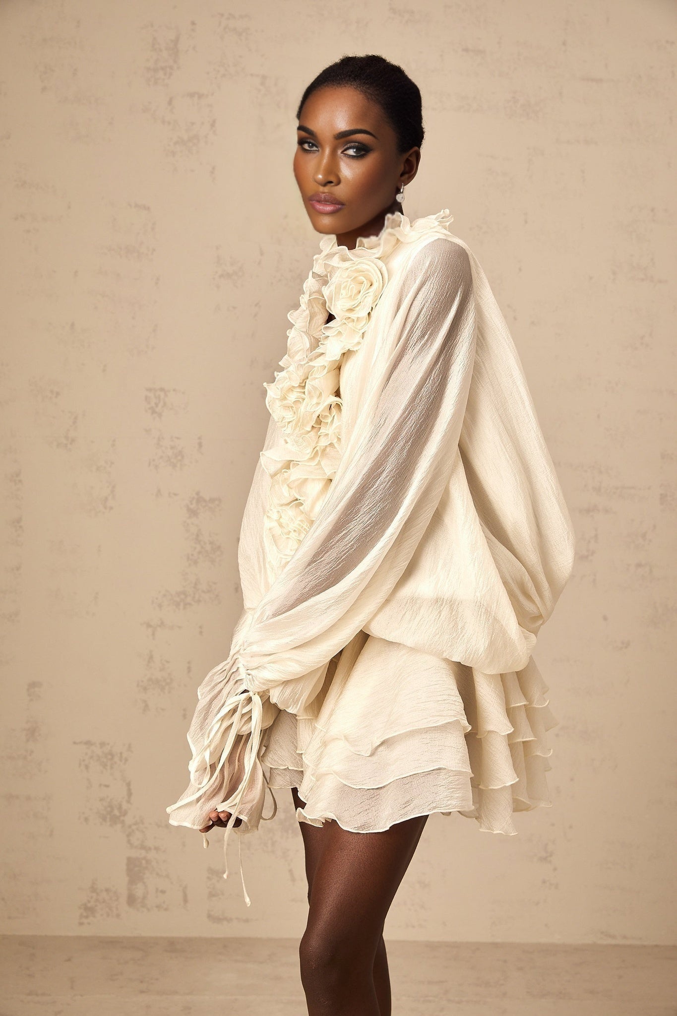 Tiered mini dress in neutral tones with floral applique details named Zephyrine