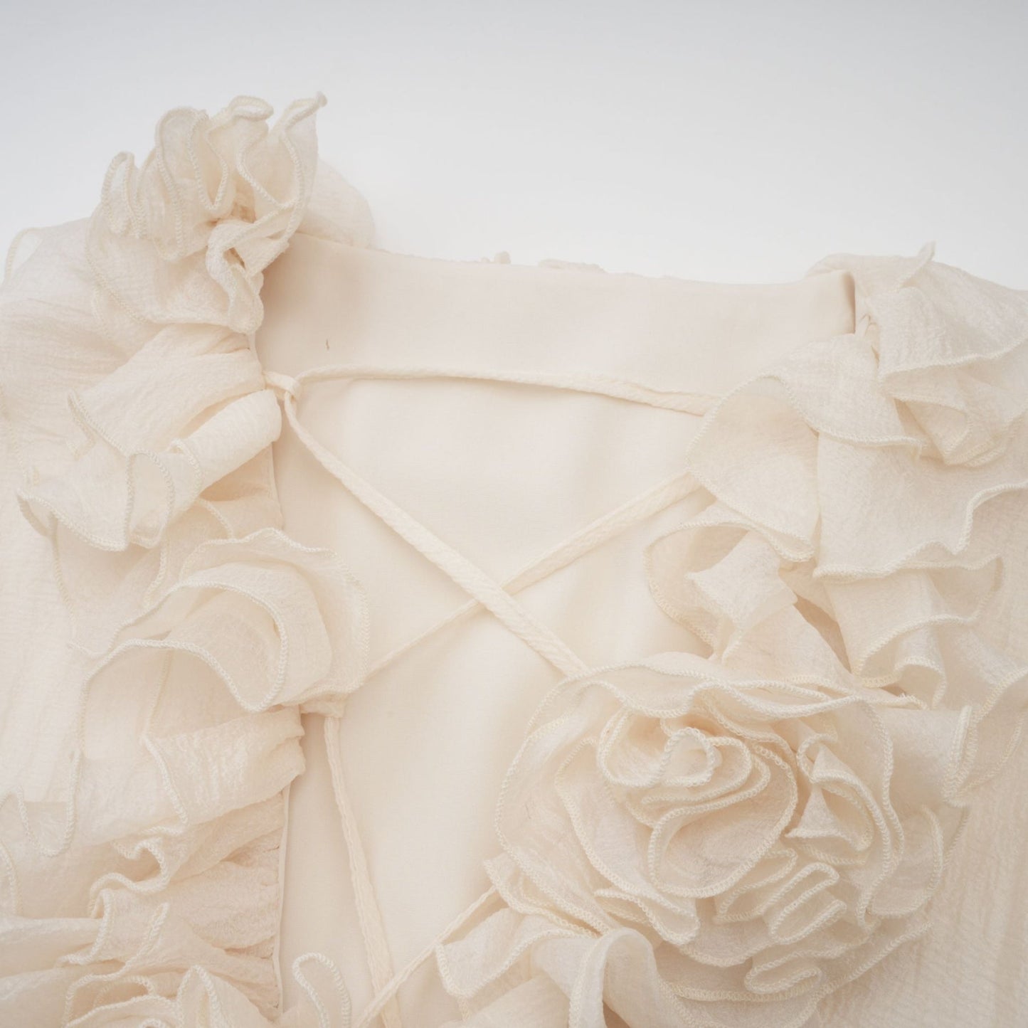 Tiered mini dress in neutral tones with floral applique details named Zephyrine