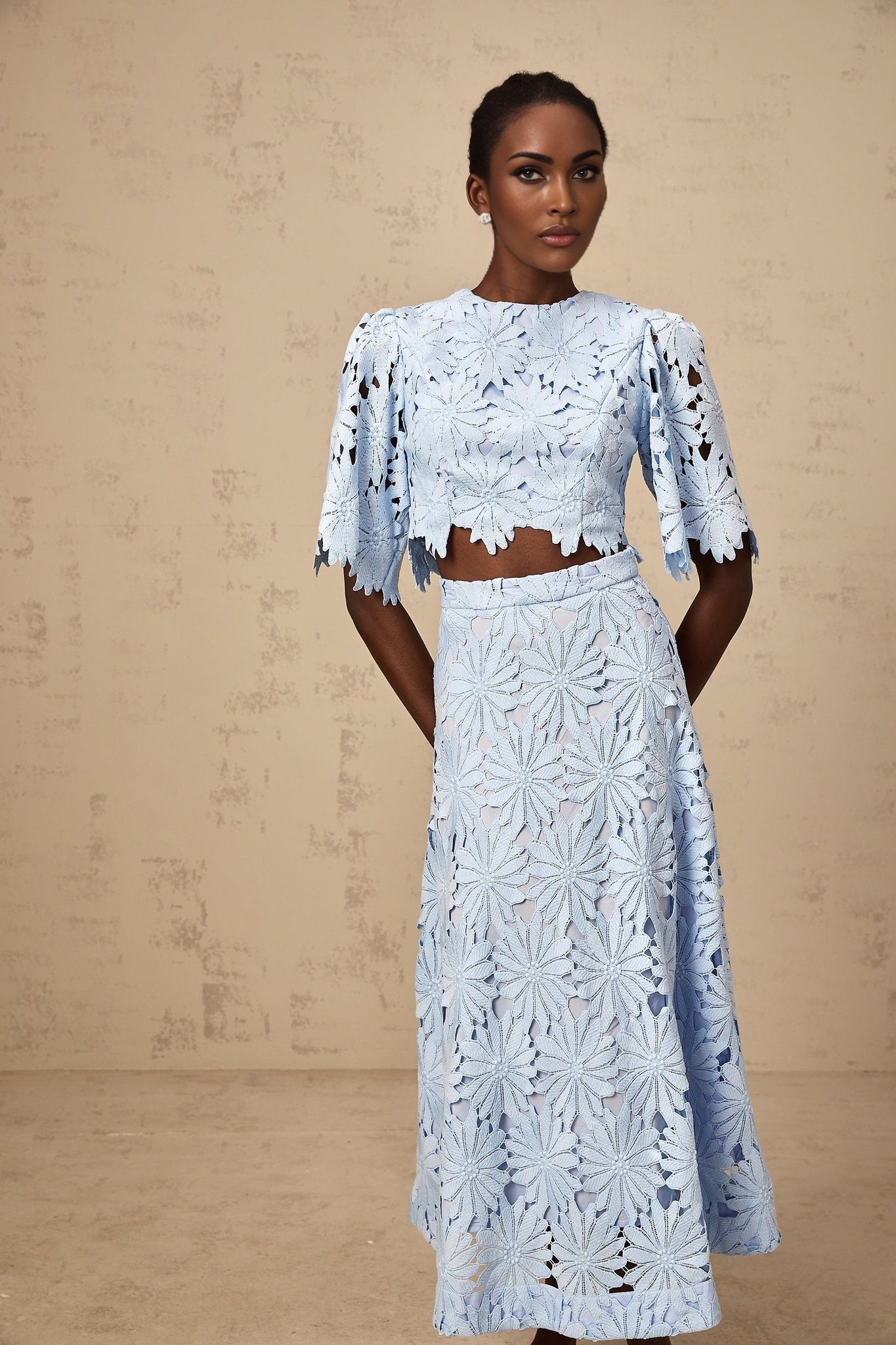 Two piece womens outfit with blue lace top and matching skirt in Audrey style