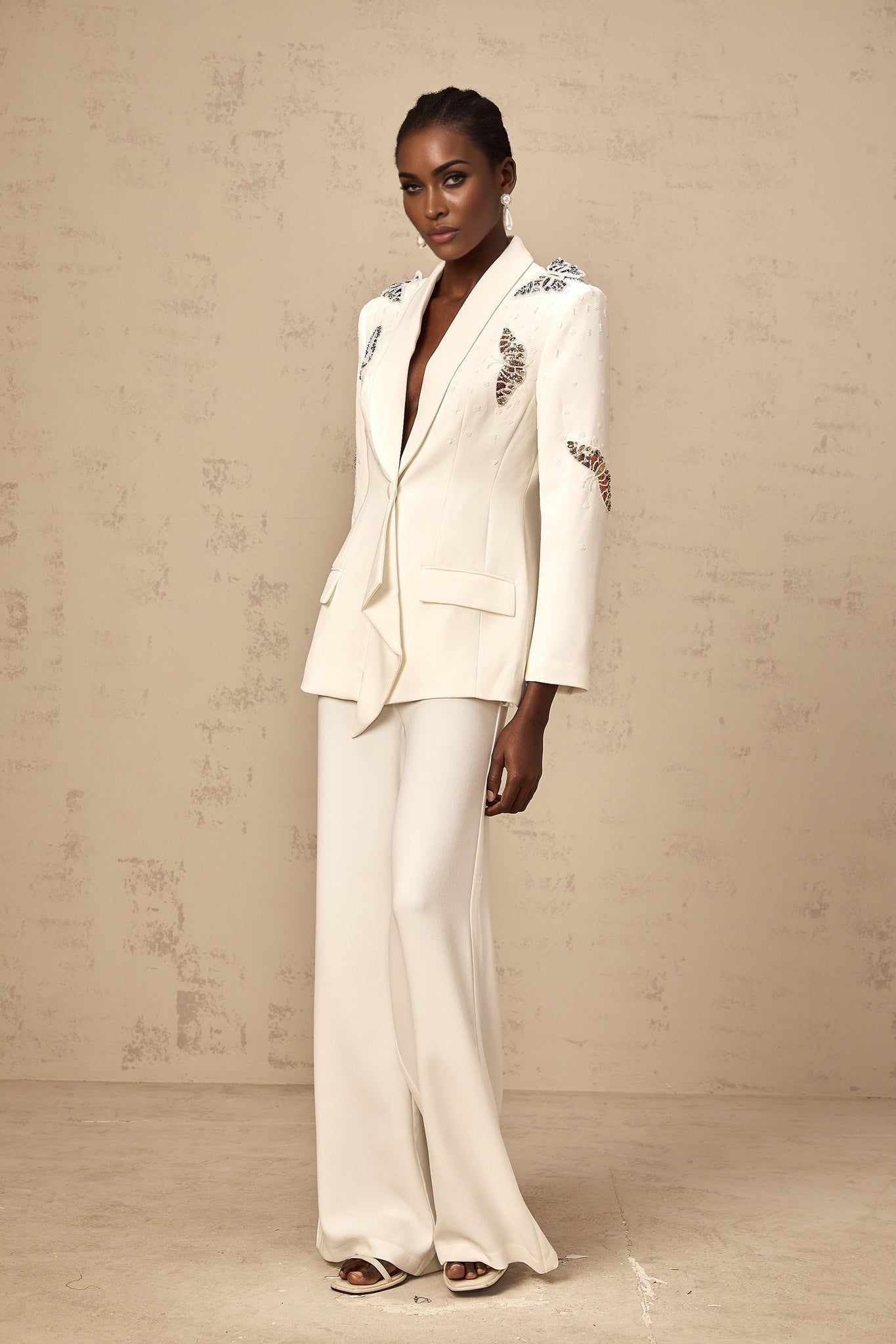 White blazer and trouser set with butterfly applique embellishments