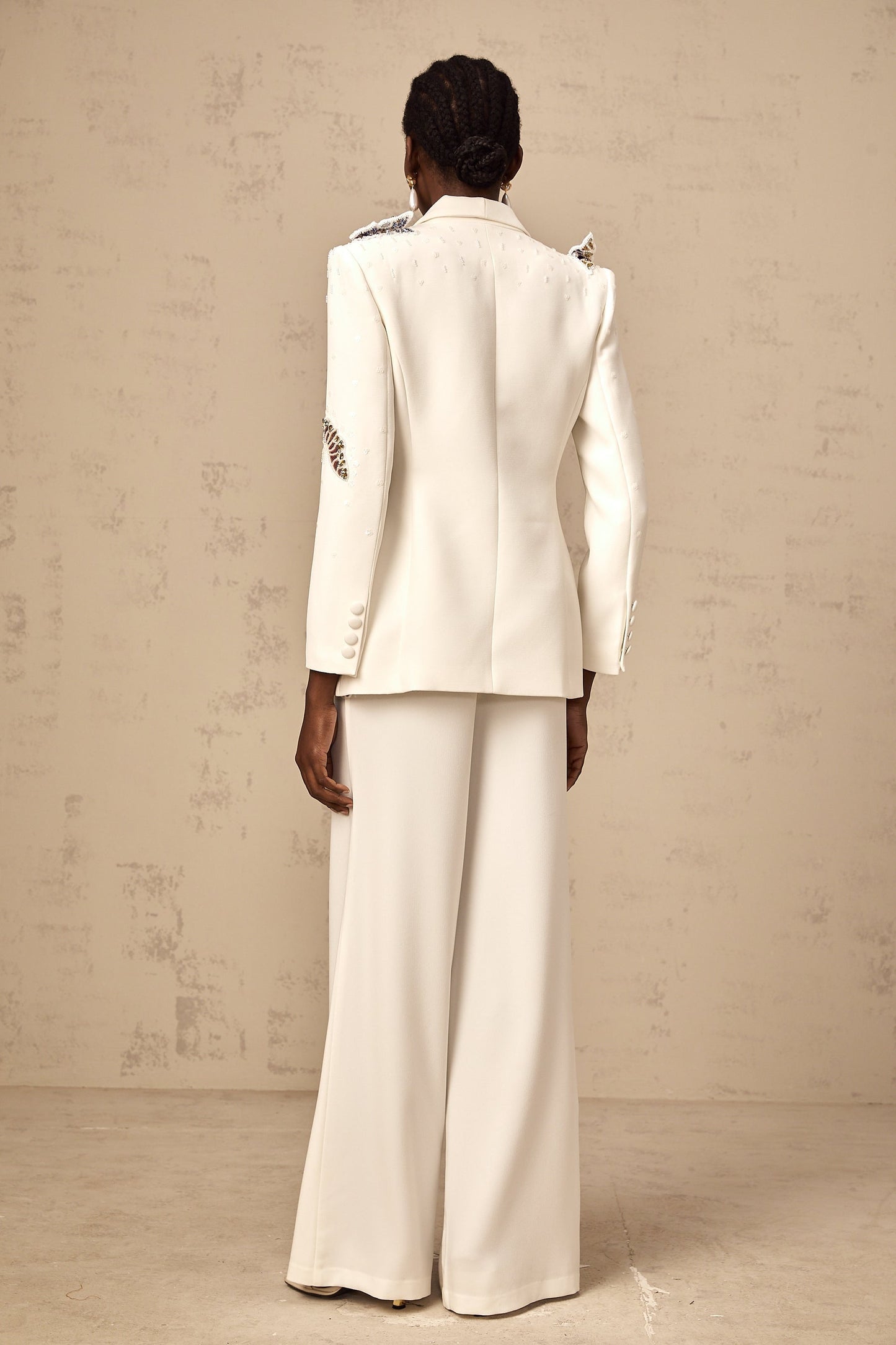 White blazer and trousers set with butterfly applique embellishments
