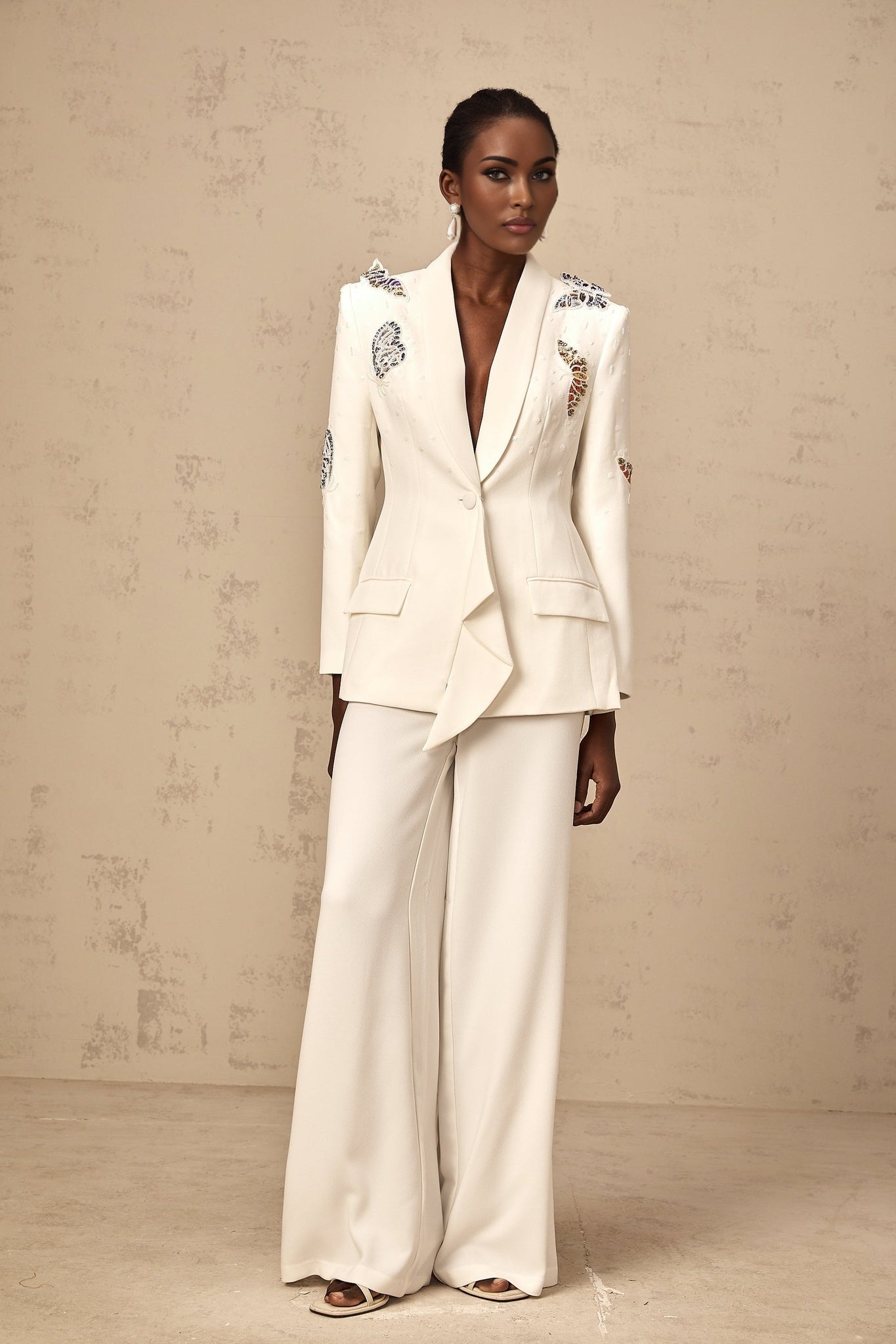 White blazer and trousers set with butterfly applique embellishments