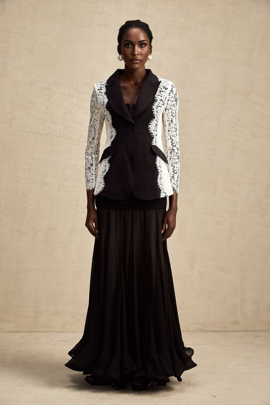 White blazer with contrasting black panels and lace trim details